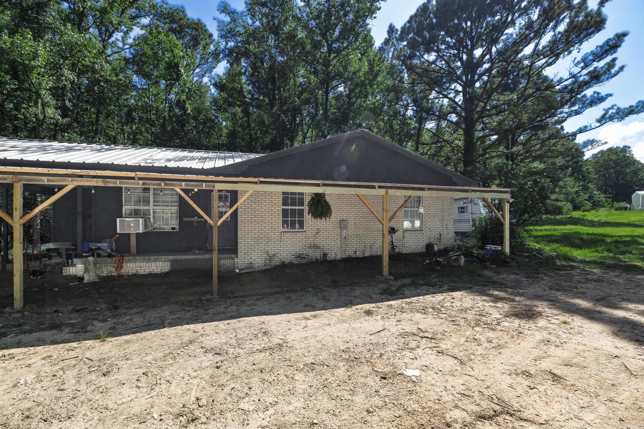 Welcome to this charming three-bedroom, two-bath home in Bismarck, Arkansas, nestled on half an acre in a peaceful, rural setting. Surrounded by Ross Foundation land, this property offers a rare sense of seclusion and natural beauty. The home has been thoughtfully updated throughout. Whether you're looking for a perfect starter home or simply craving quiet country living, this inviting space offers a great opportunity to enjoy the outdoors and escape the hustle and bustle. Don't miss your chance to own a slice of tranquility in the heart of the countryside.