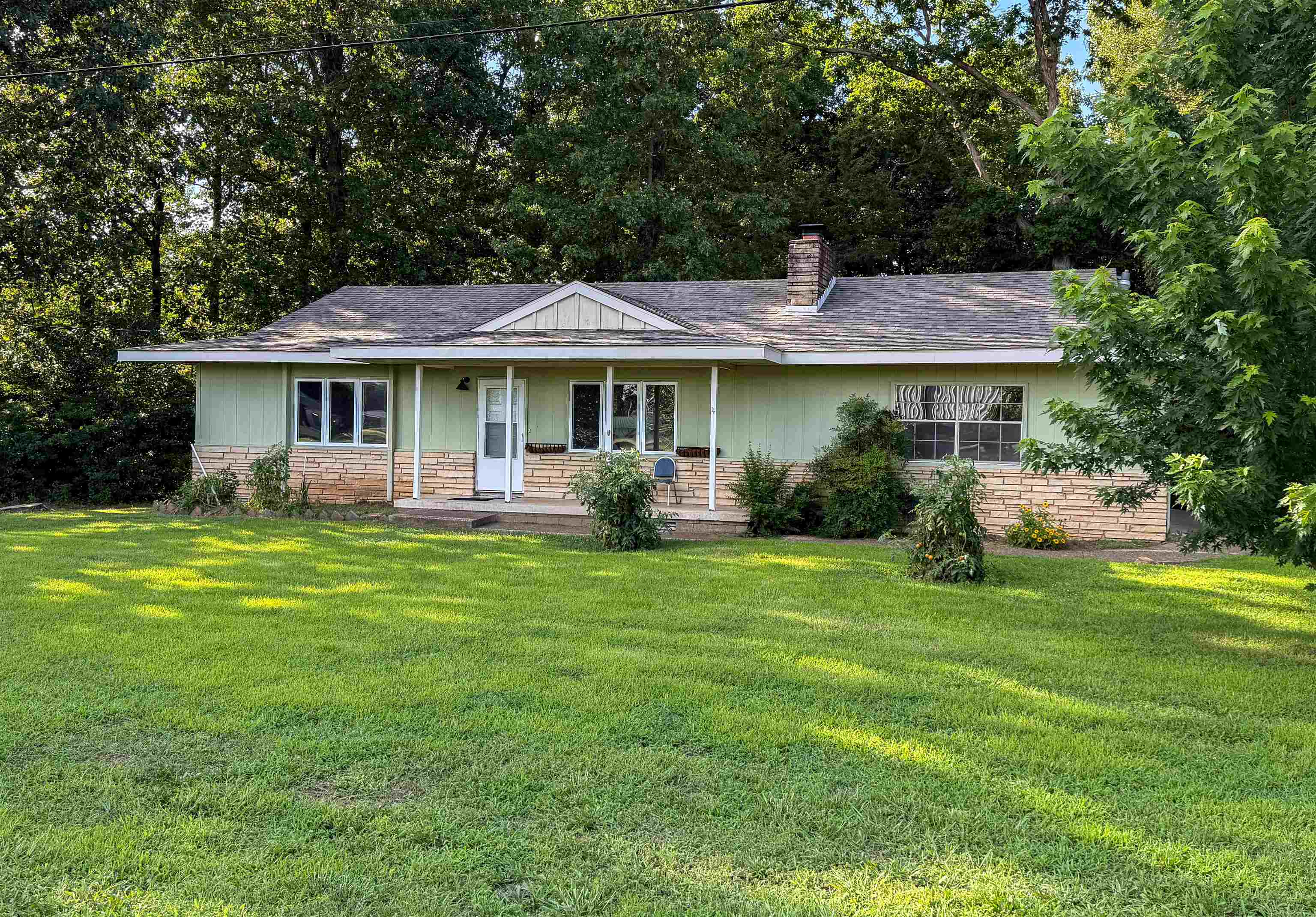 Welcome home to this neat, clean, and completely move-in ready gem! Nestled on a beautifully level corner lot, this charming 2-bedroom, 1-bathroom home offers the ultimate blend of comfort and convenience. Location is everything, and you’ll love being situated in a prime spot directly across the street from the Choctaw Center. Plus, you are just minutes away from local doctors, shopping, schools, banks, and daily amenities. Inside, the inviting living room features a cozy fireplace. The bright kitchen comes fully equipped with all appliances staying for the new owner, making your transition seamless. Just off the kitchen, you will find a wonderful sunroom—an ideal spot for your morning coffee or a relaxing reading nook boasting serene views of the peaceful woods. Rounding out this fantastic property is a 2-car attached garage, providing excellent storage and weather protection. Whether you are looking to downsize, buying your first home, or seeking a high-convenience property, this one checks all the boxes. Schedule your tour today and see this lovely home for yourself!