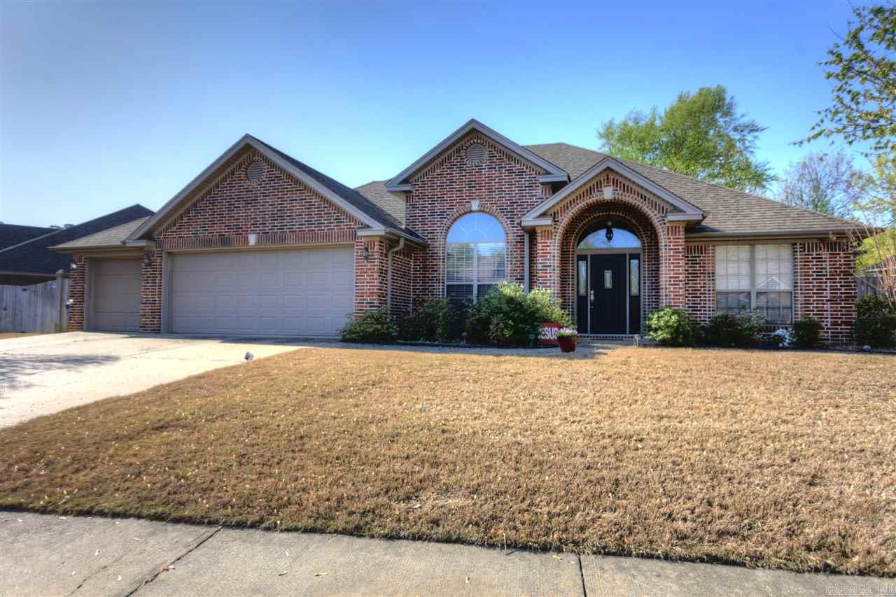 Spacious brick home, quiet street, 4 bedrooms/2 baths with 3 car garage, level lot, kitchen includes corian countertops and double sided fireplace.