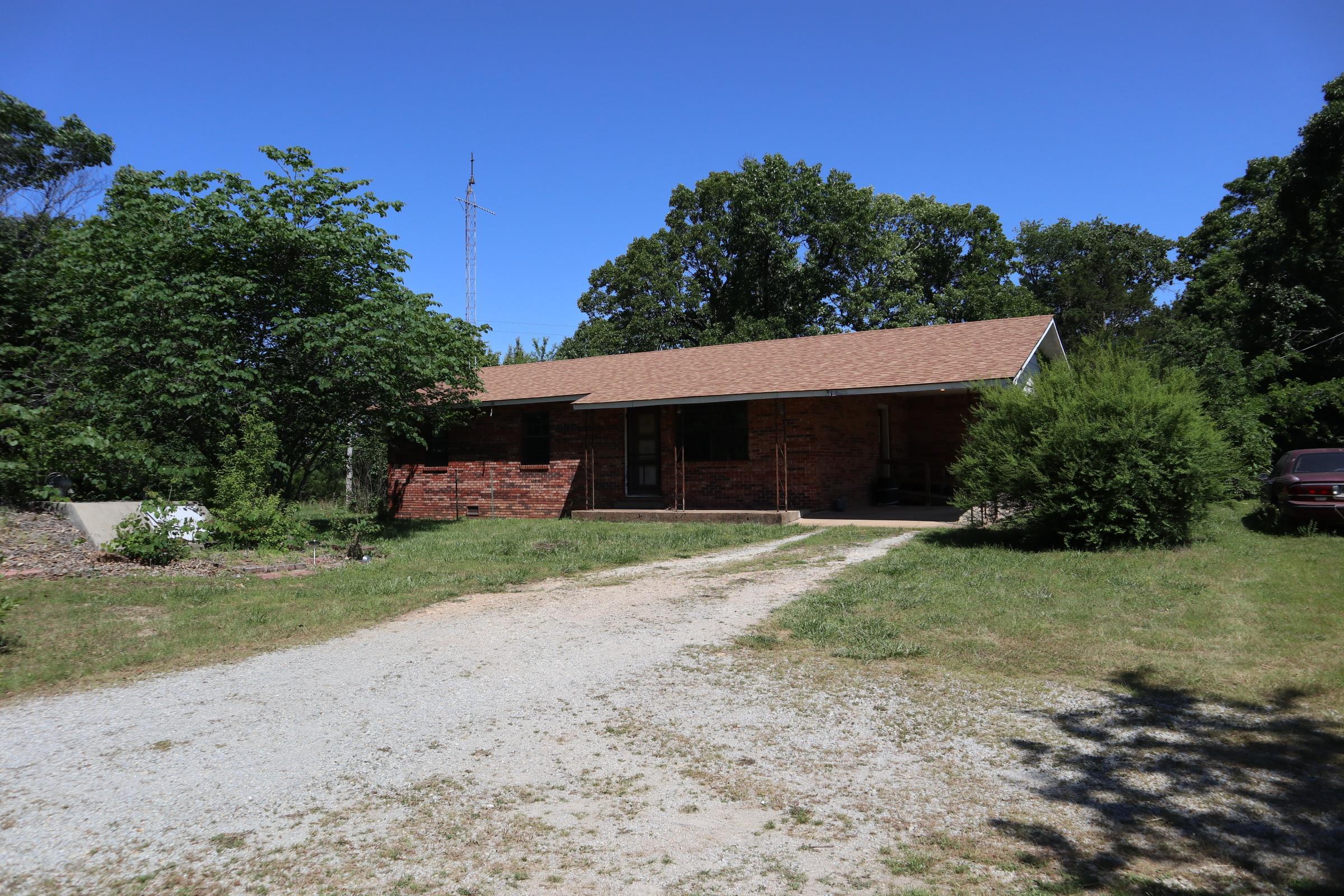 OZARKS COUNTRY HOME & ACRES FOR SALE NEAR VIOLA ARKANSAS  Property is located at 3863 Browns Chapel Rd, Viola, AR. This 3 bedroom, 1 bath brick home sits on approx. 26.66 acres just minutes from Viola. The house has a single carport, central heat & air, range, refrigerator, washer & dryer. It has a private well and septic system. Also includes propane tank. Large shaded yard with a garden area, fruit trees and storm shelter. The house is dated and will need updates. The land is divided into to separate tracts. The home sits on a 13.33 acre tract and there is another 13.33 acre tract included. NOTE: There is a 13.33 acre tract that is located in between the tracts. It is listed for sale by another owner. All three tracts must be purchased together for a closing. There is also an older barn and 2 ponds. There are a few overgrown fields with the balance in woods with mature oaks. Abundance of wildlife including deer. Property is sold AS IS. Located within 30-45 minutes of Lake Norfork and the world famous White River. Previous years taxes were $464.39. Great location approx. 1/4 mile off of pavement with county road frontage. THE SALE IS SUBJECT TO COURT APPROVAL