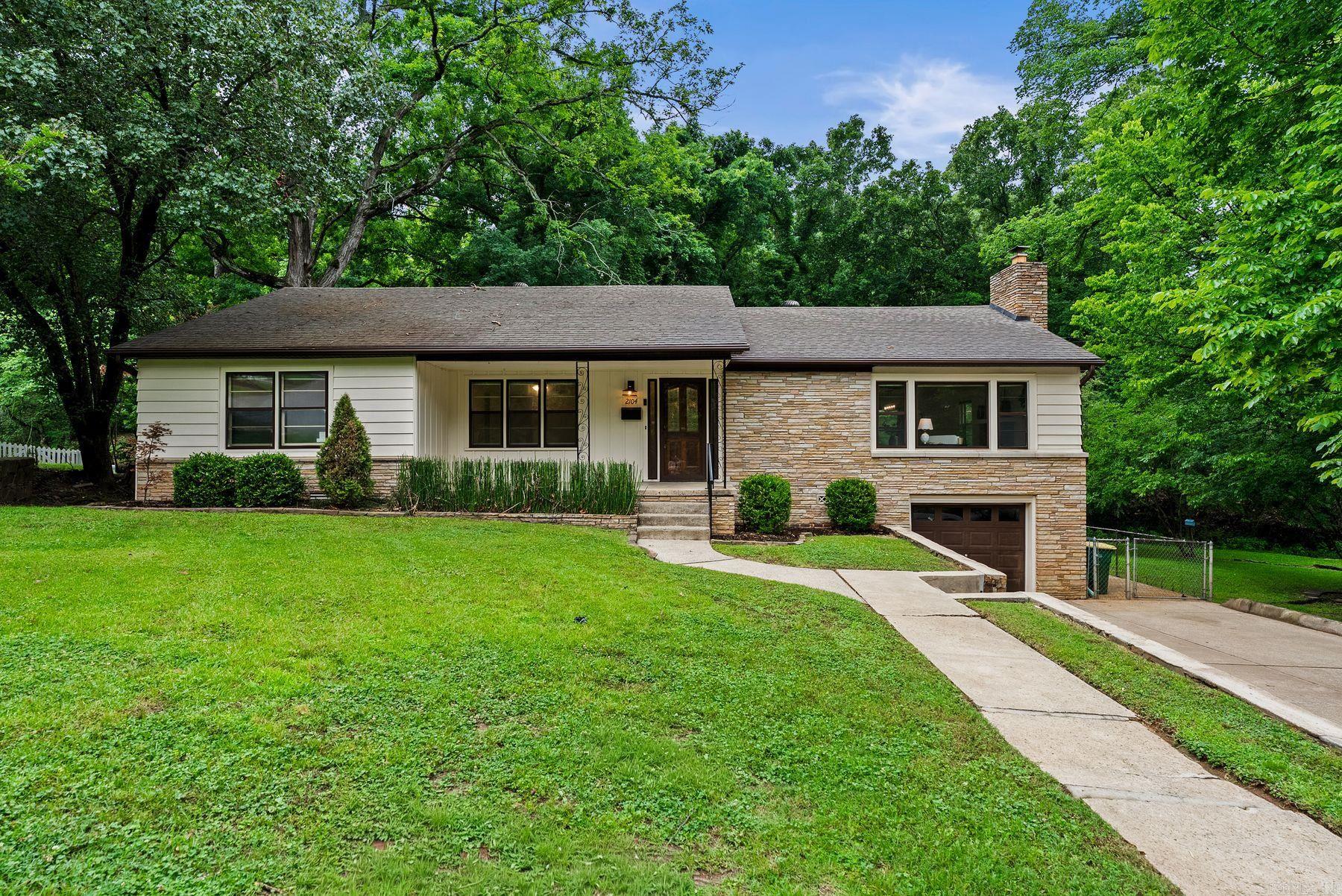 Beautifully updated and remodeled home in the highly desirable Kingwood/Queen Manor area! This charming 3-bedroom, 2-bath property blends timeless character with modern upgrades throughout. Original hardwood floors have been professionally sanded and refinished. The spacious living areas feature fresh interior and exterior paint, updated lighting, and a cozy fireplace with a custom cover. The remodeled kitchen shines with quartz countertops, stainless steel appliances, and thoughtful finishes designed for both everyday living and entertaining. Quartz surfaces continue in all baths and the laundry room, complete with a farmhouse sink for added charm and functionality.  The downstairs bonus space offers approximately 353 additional square feet not included in the listed square footage, making it perfect for a 4th bedroom, office, playroom, or flex space. Outside, enjoy a freshly sodded front yard, new landscaping, a repainted deck, and storage shed, all adding to the home’s curb appeal and outdoor enjoyment. With a newer HVAC system and numerous quality updates throughout, this move-in-ready home offers comfort, style,