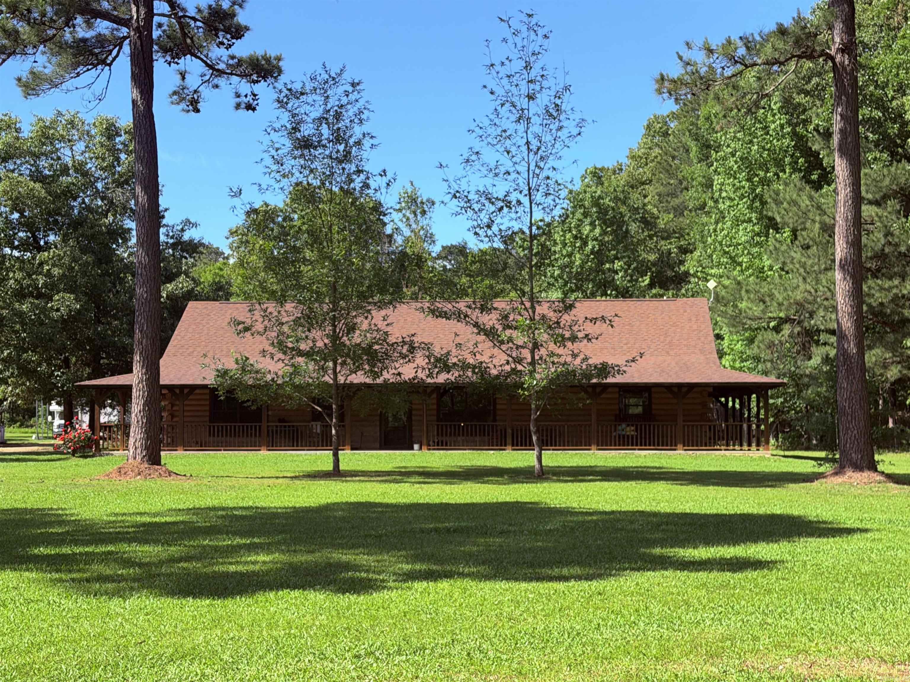 WELCOME HOME! This Beautiful Custom Build Log Cabin Is Stunning! Full Wrap Around Porch, Country Living Close To 530, Large Master Suite, Split Floor Plan, Walk In Closets, Custom Cabinets, His & Hers Closets, Walk In Shower, Jacuzzi Tub, Inclosed Storage Room, Insulated 24X30 Shop With 2 Liens On Each Side. Huge Back & Front Yards With Lots Of Privacy, Mud Room/ Laundry Room & So Much More!