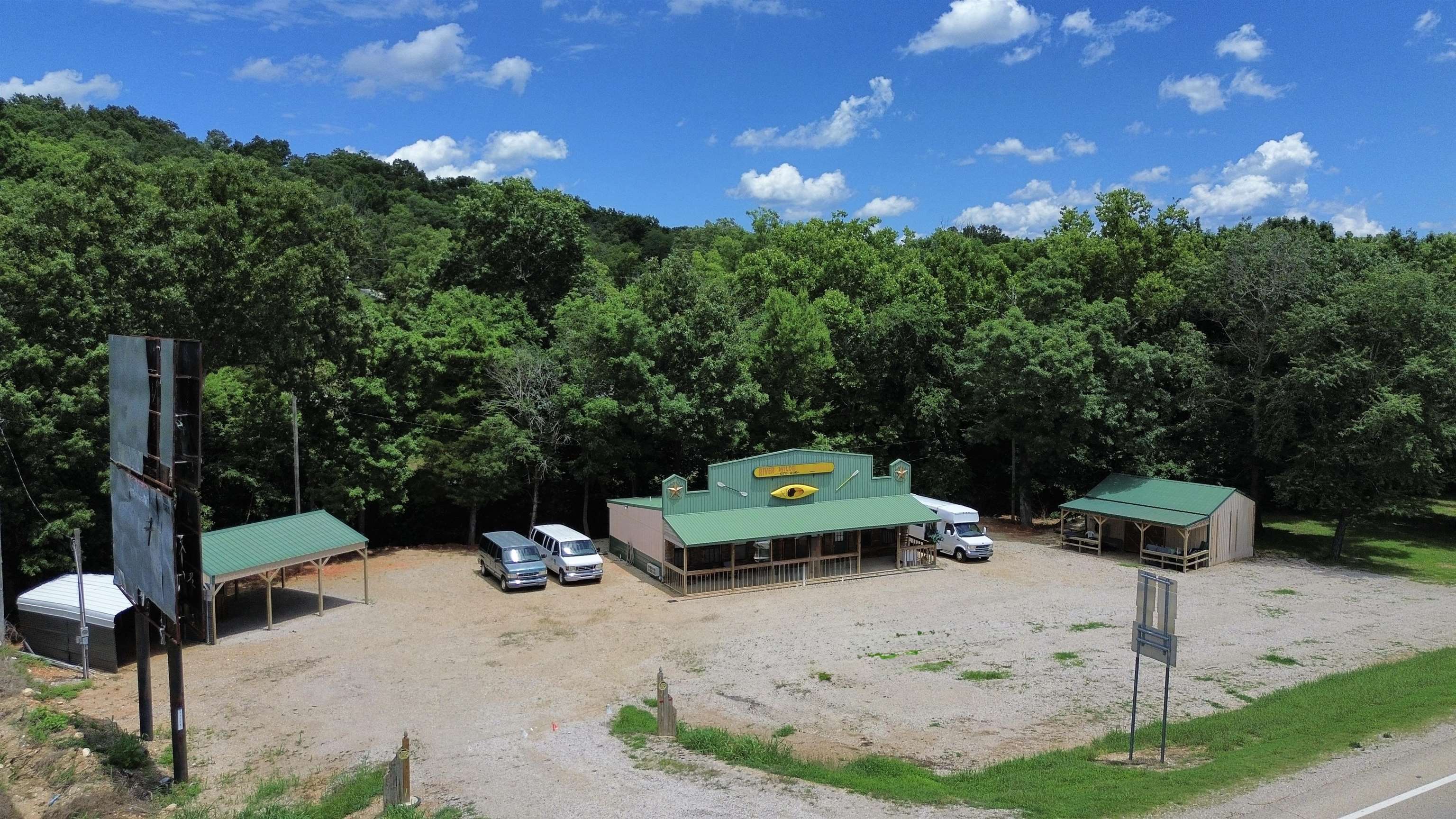Turnkey Outfitter business opportunity in Hardy, Arkansas near the world-famous Spring River, one of the most popular floating & fishing destinations in the Ozarks! This established canoe, kayak, tube, & raft rental operation is fully equipped & ready for new ownership. The sale includes a LARGE inventory of watercraft including canoes, kayaks, tubes, & rafts, plus paddles, life jackets, coolers, waterproof supplies, water shoes, hats, & retail items for floaters & anglers. Business assets include shuttle vans & buses for river transportation, trailers for hauling kayaks & canoes, & equipment needed to operate a successful float service & fishing outfitter. Property also features live bait systems for minnows & crickets & a repair shop with tools, parts, & materials for maintaining kayaks, rafts, & canoes. Located across from the Spring River Motel & minutes from historic downtown Hardy with shopping, dining, & tourism traffic. Imagine spending your days launching families onto the Spring River, watching kayaks & tubes drift downstream while building a business around the outdoor lifestyle visitors travel here to enjoy! Established website included: RiverWildernessSports.com