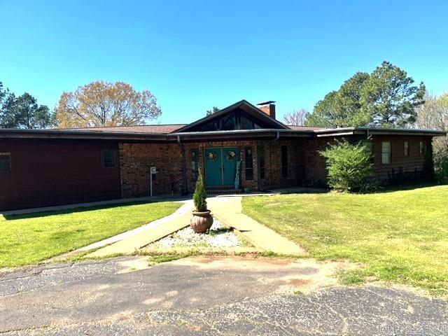This amazing home sits on 14.39 acres that over looks a 15 acre pond. It has the most stunning view that can be seen in almost every room of this 3500+/- sqft home that offers 4 bedroom 3 1/2 bath, 2 wood burning fireplaces, spacious living room with vaulted ceiling. Main bedroom has balcony that over looks inground pool and pond. Large laundry room with lots of extra  storage. Oversized shop complete with electric. This is a must see.
