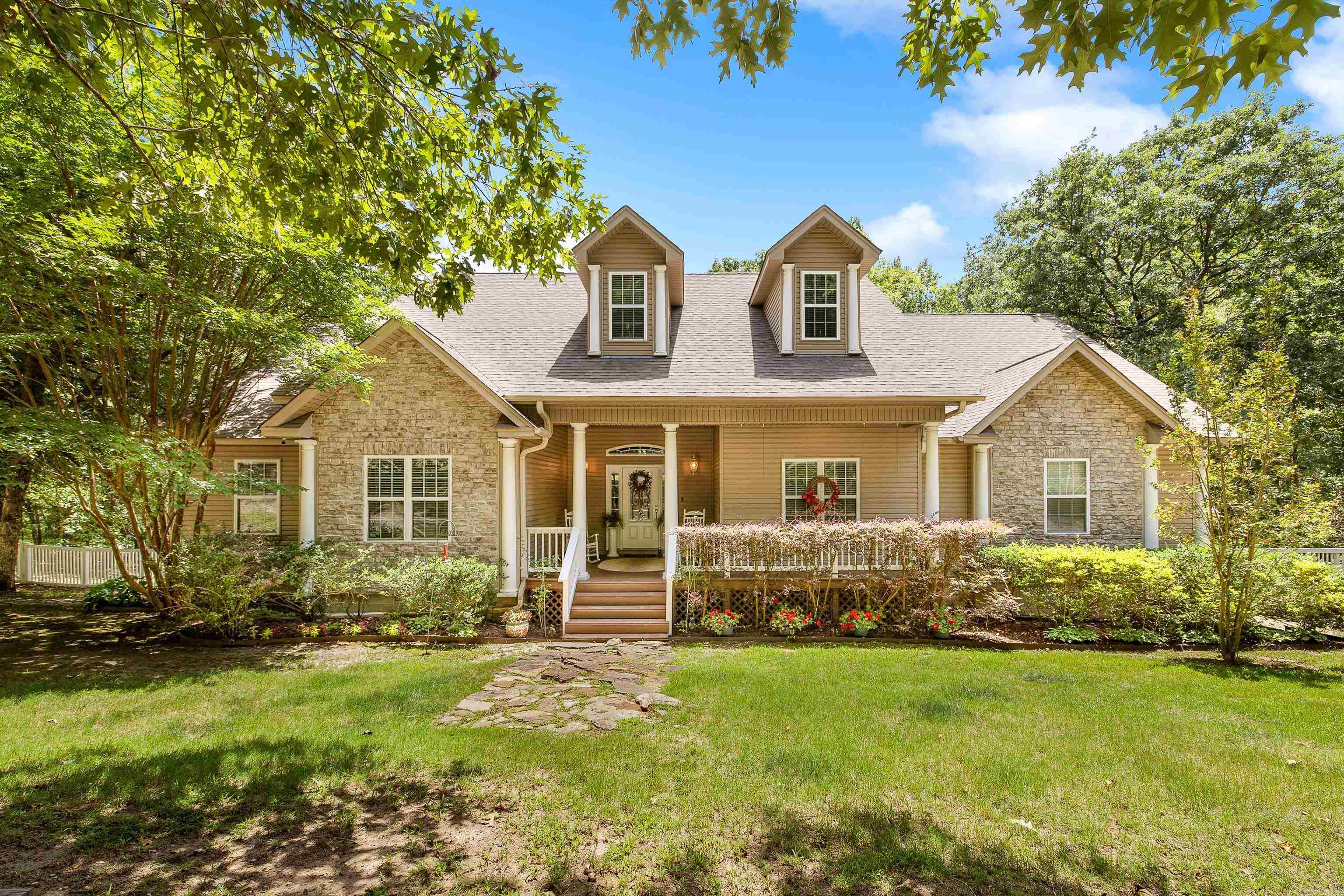 Space to spread out, privacy where it counts, and a floor plan built for real life. Set on nearly 2 acres in the East End community, this well-kept one-story home is just minutes from excellent schools, shopping, and easy access to Little Rock. With 2,371 sq ft, the primary suite is tucked away from the other three bedrooms, plus a separate guest bedroom apart — ideal for multigenerational living, visiting family, or simply having your own quiet corner. Gather in the great room around a wood-burning fireplace, host in the separate dining room, or cook in the eat-in kitchen with breakfast bar and pantry, then unwind on the screened porch or deck overlooking a fully fenced yard. A two-car garage adds everyday convenience, and the acreage leaves room for a garden, animals, a shop, or whatever hobby brought you here. No HOA, outside city limits — just room to live. Schedule your showing today.