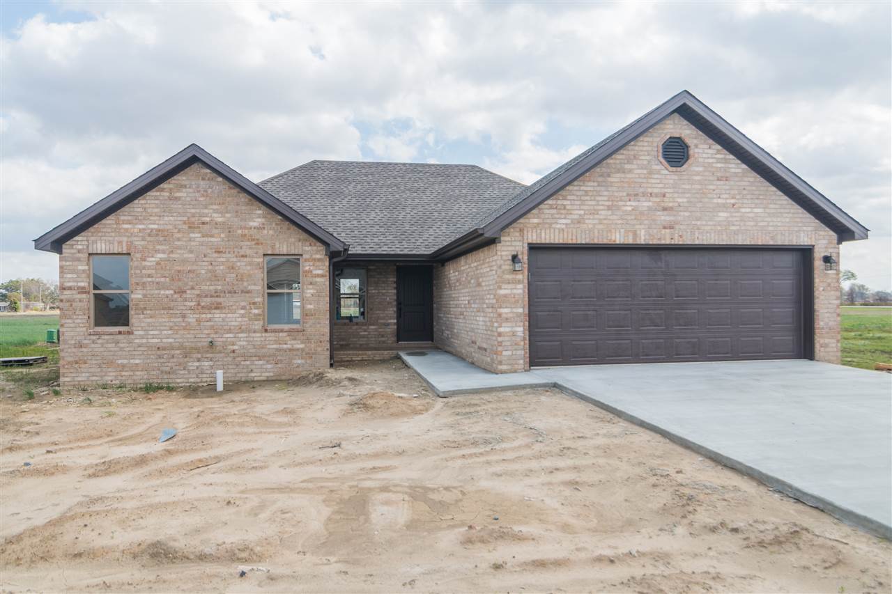 This is a beautiful new construction brick home in the Manila School District. It features a two car garage and an open floor plan. Spacious living room sits right off the entrance with lovely hardwood flooring that leads into the eat-in kitchen. The kitchen offers granite countertops, abundant custom cabinetry, and new stainless steel appliances. Master bedroom includes vaulted ceiling, dual vanity, shower and tub combo with tile backsplash, and two walk-in closets with built-ins. Great first time home.