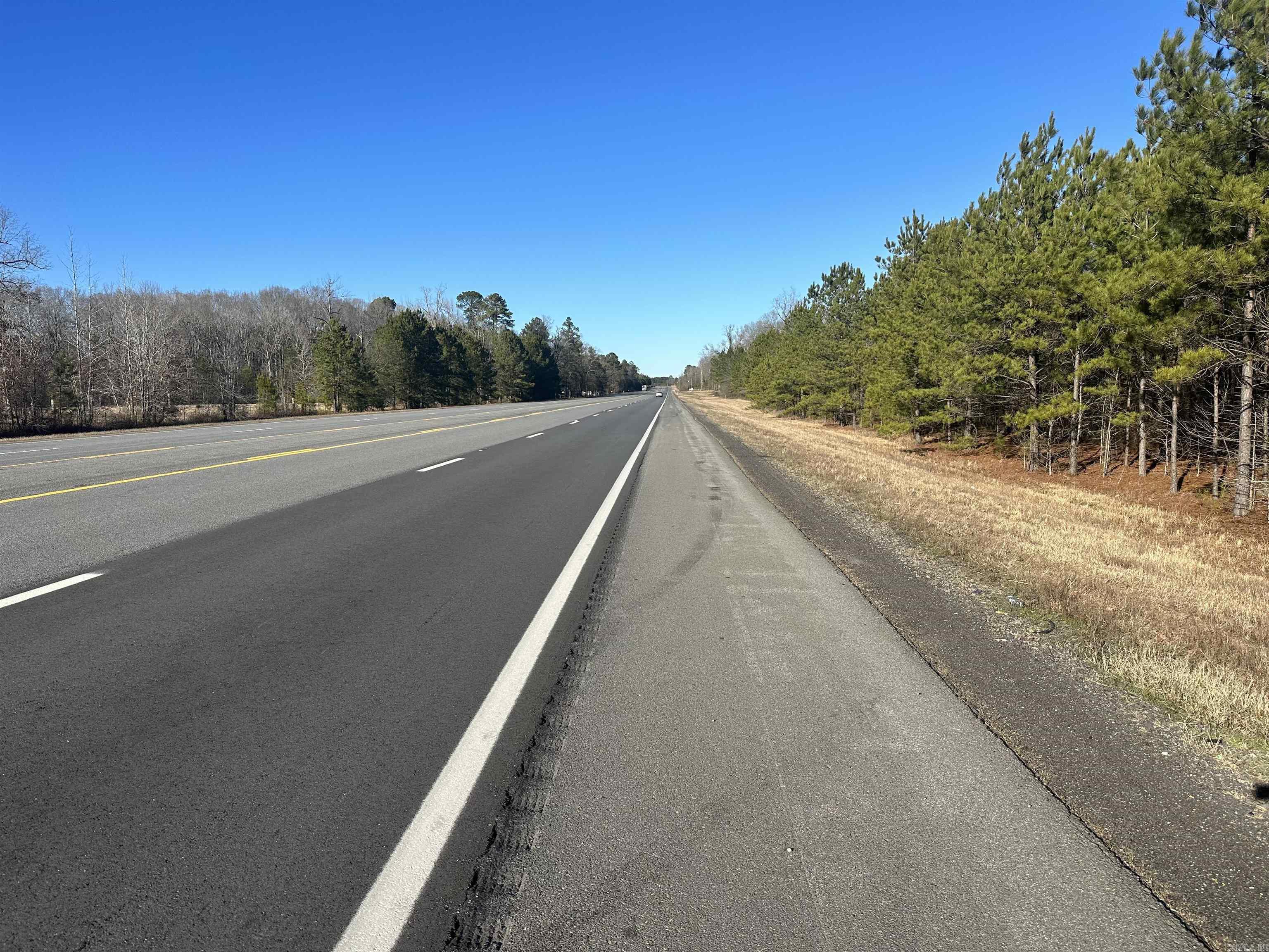 Great location for home site or development. This tract has lots of road frontage and is wooded. Call for more details!