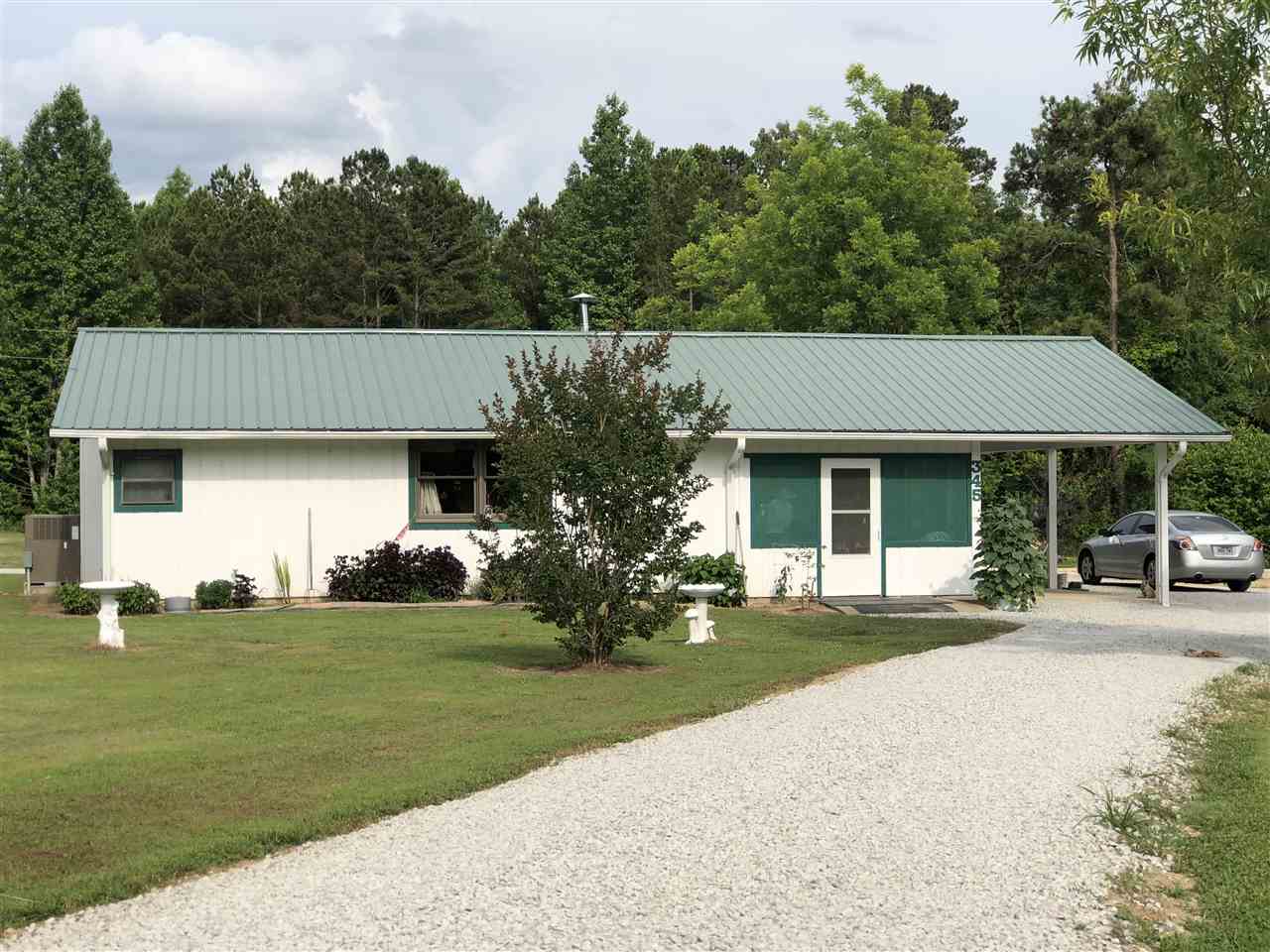 This beautiful country home sits on 8.0 acres of cleared land, but some woods in the back. The 3 bed 2 bath home comes with a 45x60 shop with a car-lift.  This home also includes a separate living quarters in a 40x40 shophouse that is 1240 sq ft, 2 bedroom 1 bath. See MLS# 18019264 for all 3 properties and 10 acres. This is for two properties & 8 acres of land with 2 ponds. This is a DEAL folks, don't miss your chance to own it.