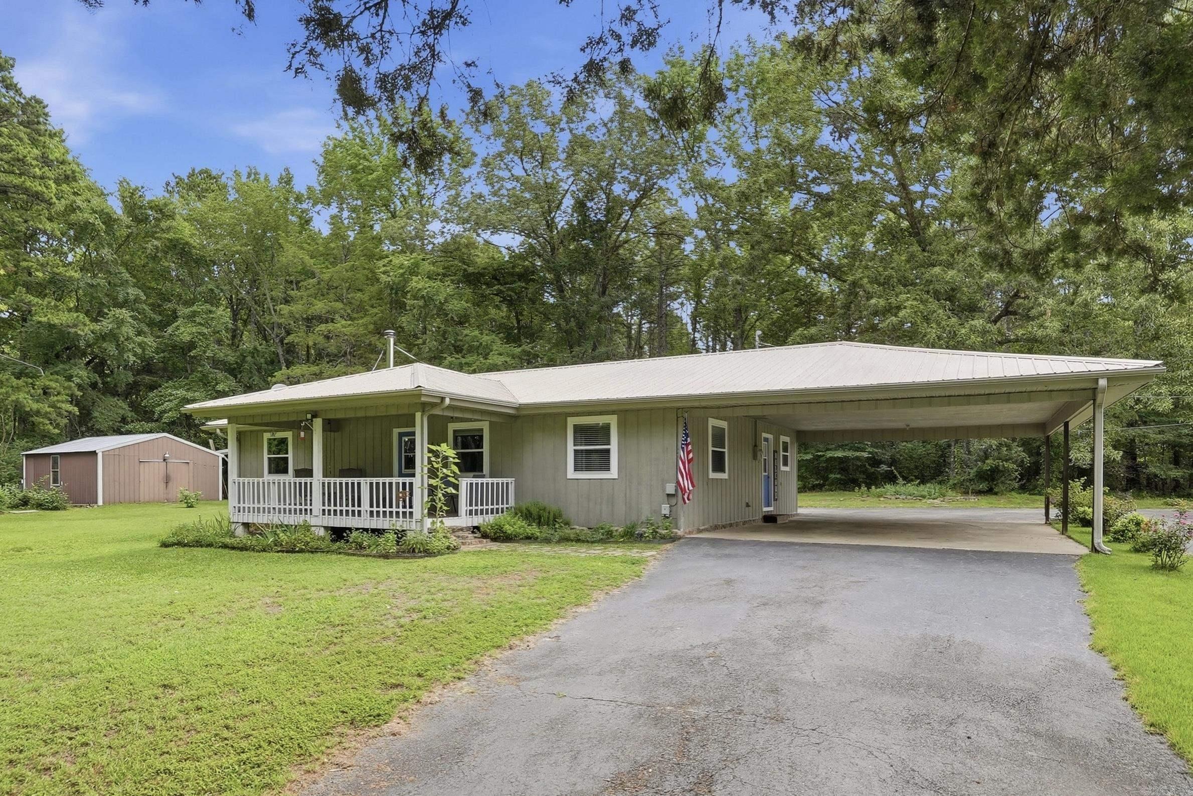 Super Cute Home only 3 miles from Shiloh Marina, sits on 3 level acres with a 24X24 concrete floored Metal Shop. **Priced to sell fast. Sellers have made many improvements since their ownership: All new windows installed January 2022, added guttering around the rest of home in August 2024, New HVAC system (Inside & outside) March 2024, New Refrigerator December 2024, & Replaced on-demand water heater September 2025. Nice layout with 2 Guest bedrooms/1 full bath on one side of the Primary Bedroom with full bath has been converted into their Workout/Office Space (they removed closet for their needs in this bedroom but could easily be added back). Grilling porch off of kitchen (gas line stubbed up to grill & grill will stay). This 3 acres is out of the city limits, not in a subdivision, & unrestricted.  Have your privacy and your freedom plus a short drive to Greers Ferry Lake.