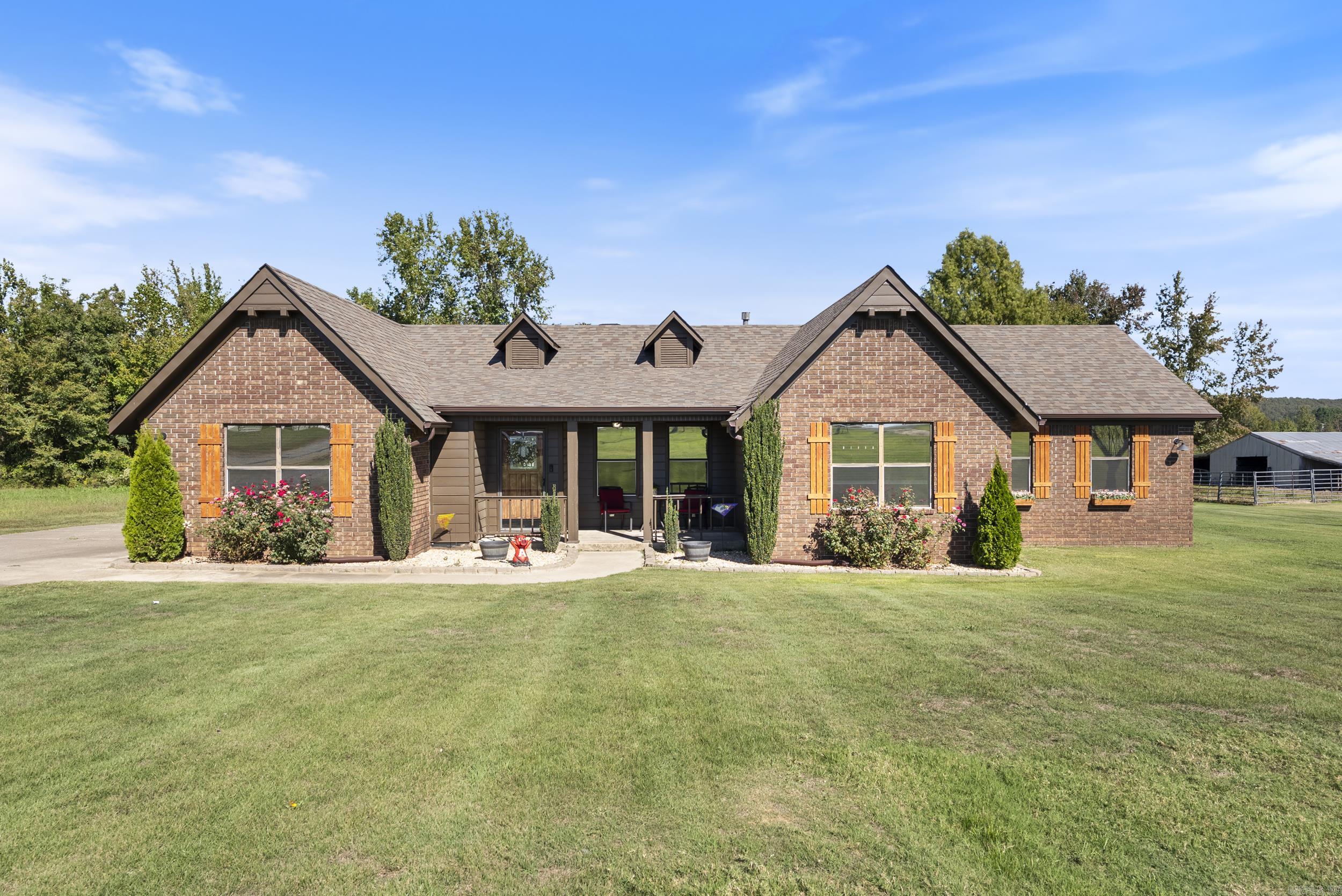 Open the doors to this charming 3 bedroom, 2 bathroom home nestled on 4 acres with a total 20x50 shop. Inside, you’ll find a spacious living room centered around a cozy wood-burning fireplace, roomy bedrooms with walk-in closets, and an updated kitchen designed for both style and function. Beautifully remodeled in 2022, this home has so much to offer, featuring professional interior and exterior paint, new luxury vinyl plank flooring, updated lighting, doors and hardware, tinted windows, a new gas water heater, granite countertops, and stainless steel appliances. The central heating and air unit, along with all ductwork, was also replaced in 2022. The fireplace was fully inspected and swept in 2023, complete with a custom chimney cap for added peace of mind. Step outside to your own private retreat, the backyard is perfect for entertaining or relaxing, featuring a large deck and a covered outdoor bar or  BBQ area. And don’t forget the shop, offering the extra space you’ve been looking for! The shop is split into a 20x40 with an additional 10x40 split on the back side. To top it all off, this home includes a new roof and gutters installed in 2024.