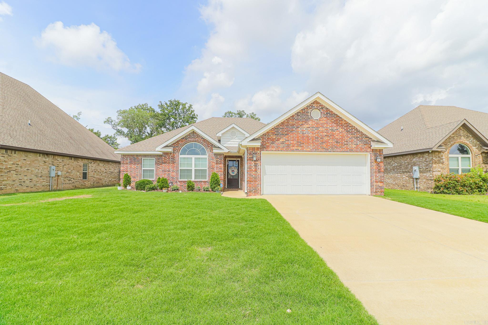 Move-in ready and beautifully designed, this 4-bedroom, 2-bath all-brick home in the highly sought-after Valley View School District offers the perfect blend of comfort, style, and efficiency. Step inside to an open-concept floor plan featuring impressive 12-foot raised ceilings in the great room, kitchen, and breakfast area, creating a spacious and inviting atmosphere. Multiple windows surround the breakfast area, filling the home with abundant natural light. The kitchen is both functional and stylish with granite countertops, a stainless farmhouse sink, subway tile backsplash, gas range, and ample workspace for cooking and entertaining. The spacious living room centers around a beautiful brick fireplace with gas logs, making it the perfect gathering space. The primary suite features a tray ceiling and a luxurious bath complete with double vanities, a relaxing soaker tub with tile surround, custom tile walk-in shower with glass door, and an oversized walk-in closet. Designed with a desirable split-bedroom layout, the private primary suite is separated from the additional bedrooms for added comfort and functionality.