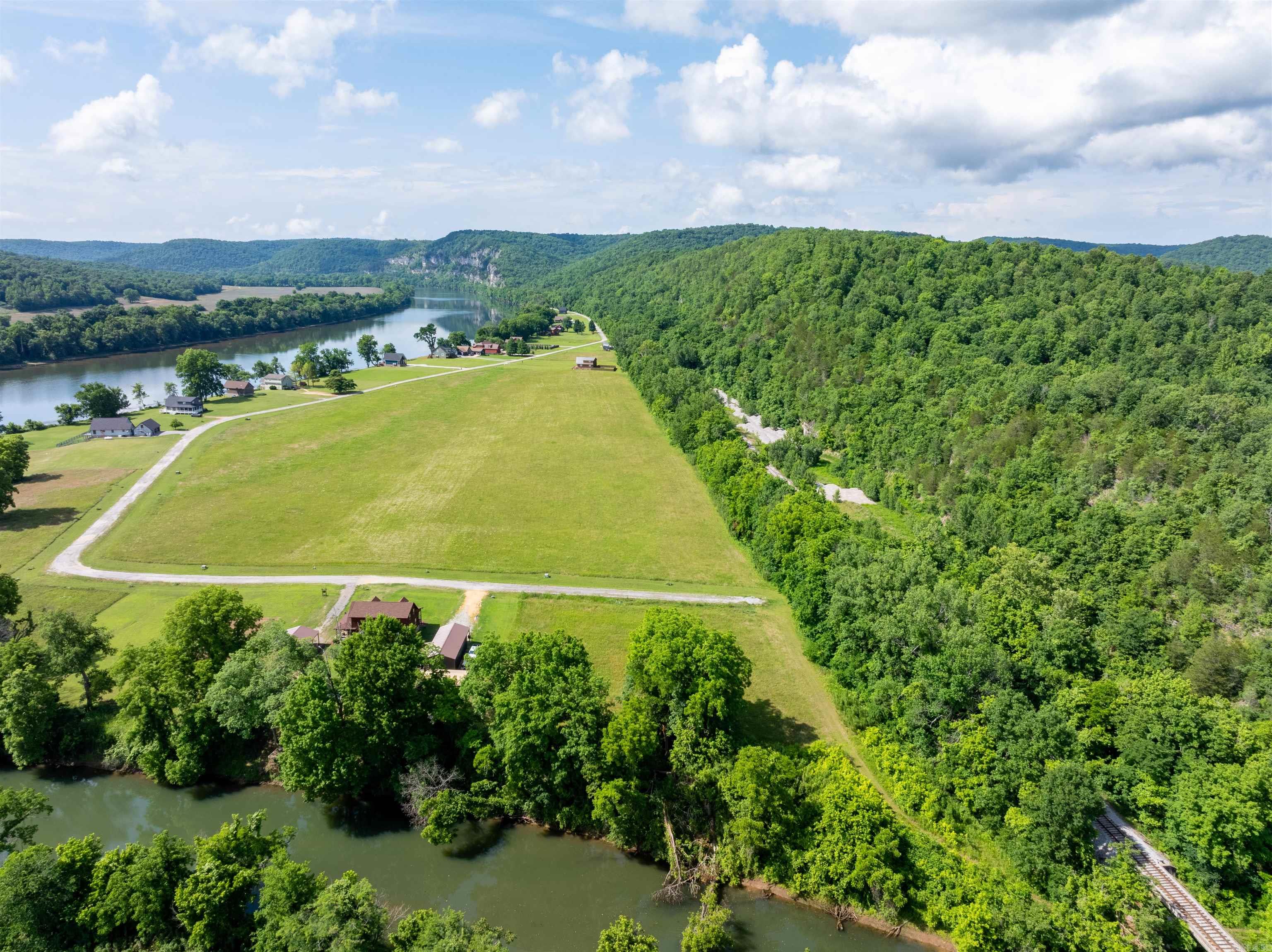 Creekfront Lots Near White River | Gated Community Near Batesville, AR Located at the end of Joe Baker Road just outside Batesville, Arkansas, these two side-by-side lots offer a rare opportunity to build your dream home, vacation retreat, or weekend getaway in a private gated community near the White River. Nestled at the mouth of Lafferty Creek where it meets the legendary White River, these lots provide a peaceful creekfront setting with beautiful water views and abundant wildlife. Imagine relaxing on your future deck while watching the seasons change around you, all while being only approximately 1,100 feet from the main flow of the White River and about 4,600 feet from the private community boat ramp. Property owners enjoy gated access and use of the community boat ramp, providing convenient access to the world-famous White River, known for fishing, boating, kayaking, and incredible scenery. Build between the two lots and enjoy views of Painter's Bluff, the surrounding bluffs, and the natural beauty that makes this area so desirable.Per sellers, these lots do not flood but buyers must do their own due diligence.