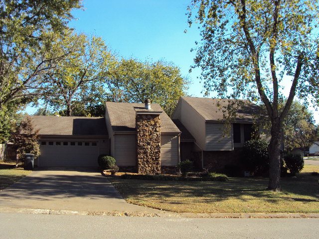 Great corner lot setting for this four bedroom, three bath with both great room and game room.  Beautiful hardwood floors in the open kitchen and dining.  The breakfast bar is movable to allow even more space.  Vinyl and stone exterior.  Two heat and air units with upstairs unit brand new.  Over 2500 square feet make this one a great buy.  Tri-level with main level entry, great room, kitchen and dining.