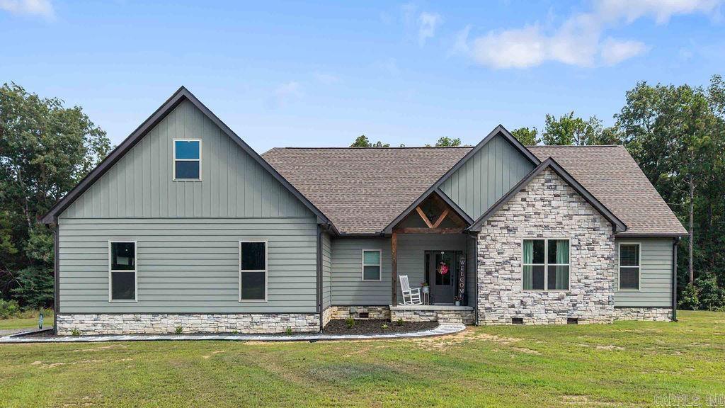 Beautifully crafted newer construction modern country home. Located between Rose Bud and Quitman on 16 acres surrounded by mature trees, with plenty of privacy and lots of space to roam. The open floor concept features luxury plank vinyl flooring, lots of natural light, stunning chef's kitchen with large quartz island, custom cabinets and stainless steel appliances with a stunning electric fireplace which is perfect for everyday living or entertaining. Tons of curb appeal with this home, oversized covered deck and garage! If your looking for a quiet retreat and a space for children to play and enjoy the outdoors, with all the modern amenities of country living, this is the one!!!