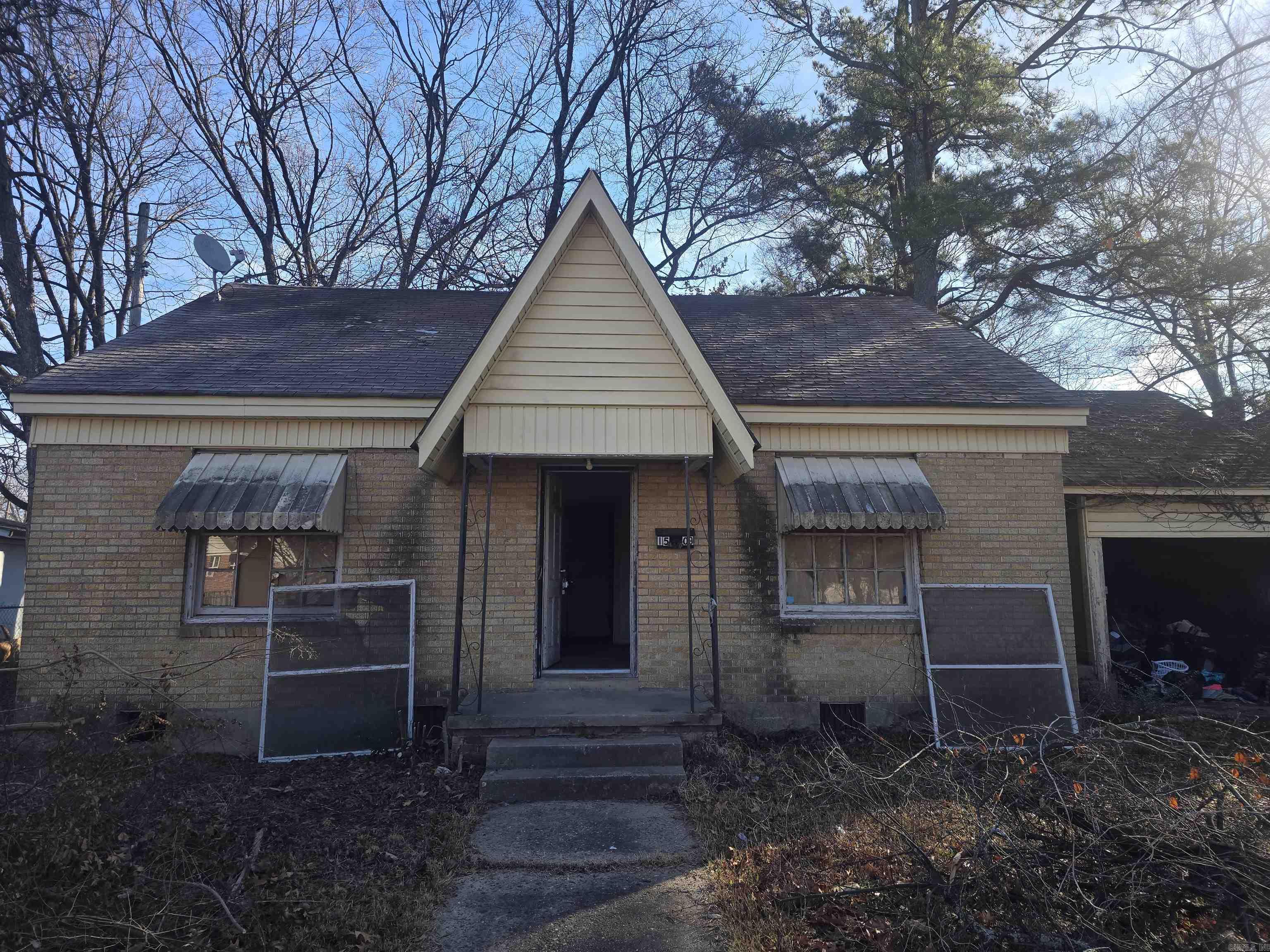 2 bedroom, 2 bath home offering a great opportunity for investors or buyers seeking a renovation project. Property is in need of extensive repairs and updates throughout. Sold as-is. Owner financing available with acceptable down payment and terms. Ideal for rehab, rental, or value-add investment.  AGENTS SEE REMARKS