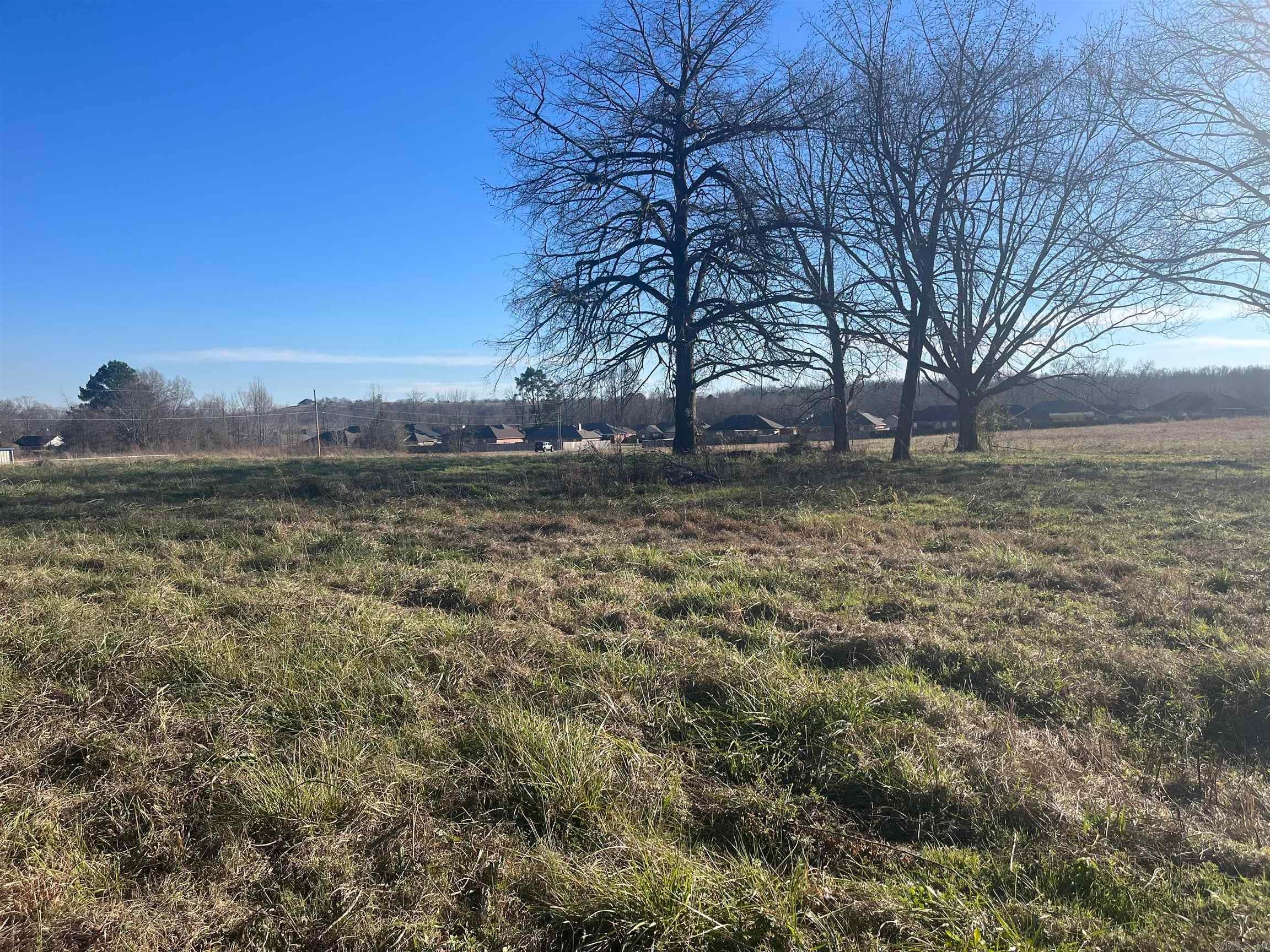 CORNER PROPERTY 7 ACRES ON CORNER OF HWY 64 B AND EAGLEBROOK DR. PROPERTY CAN BE DIVIDED IN 2 ACRES ON FRONTAGE OF HWY 64 AND EAGLEBROOK DR. OR 5 ACRES ON EAGLEBROOK DR. SOME UTILITIES AVAILABLE BUT NOT INSTALLED. PROPERTY CAN BE COMMERCIAL OR EXCELLENT SPOT FOR STORAGE FACILITY ALSO COULD BE USED FOR SUBDIVISION. WILL NEED SEPTIC TANK. SEE MLS # FOR ADDITIONAL INFO.  TOTAL ACREAGE AMOUNT TO BE DETERMINED BY SURVEY.