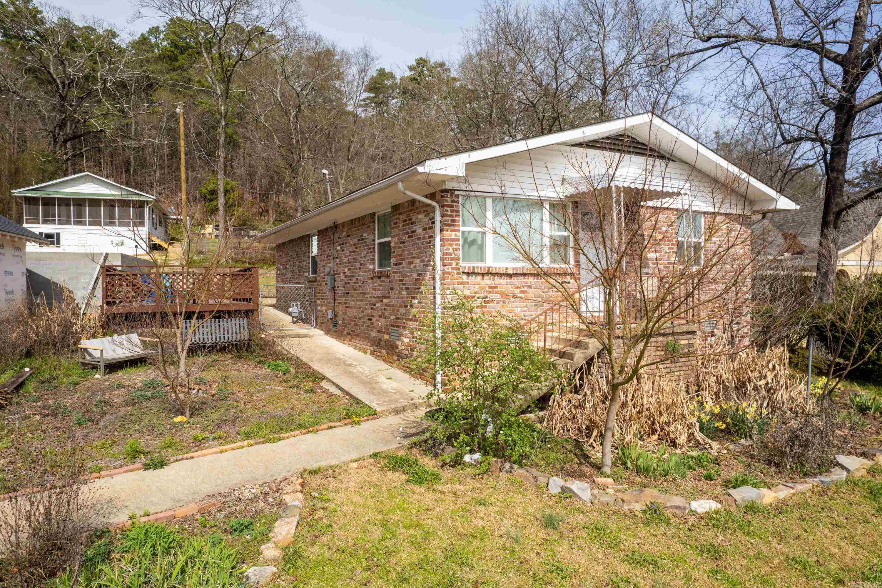 Updated and remodeled licensed S-T-R in the Historic District next to West Mountain Dr and the National Park's West Mountain Trail system selling furnished and turnkey! Amazing Quapaw/Prospect location on this little gem that puts you close to Historic Downtown, Sidetown, and Uptown in a walking neighborhood where front porch get-togethers are still a thing! The open concept living areas make the space live large, perfect for entertaining. Original hardwoods add warmth and charm while modern appliances and updates add to the light and bright feel. Don't let the front steps fool you, rear entry off Curve Terrace with a carport offers convenient entry to the house. Not easy to find anything in this location for this price point especially with S-T-R licensing, so whether your downsizing to a dream location or investing in downtown Hot Springs, schedule your showing today!