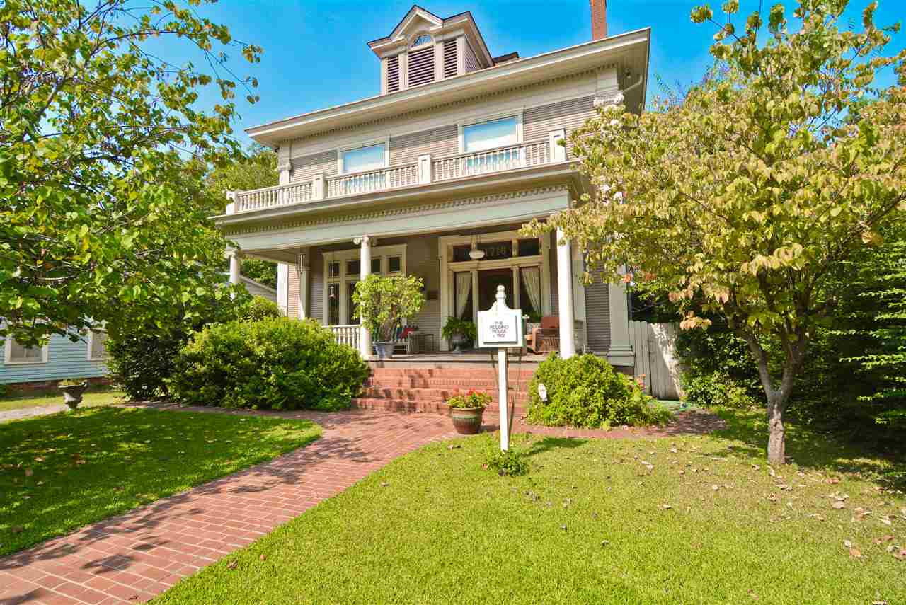 The Redding House circa 1902. Greek Revival Columns grace one of the nicest front porches in Little Rock. The foyer welcomes you with dark mahogany details. 7 fireplaces, 4 set of original pocket doors, a sunroom, 13 ft. ceilings, Original doors, hardware, windows, and period lighting. A large master bath area that could be converted into an amazing suite. Newer roof, hot water heater, and insulation. 3rd floor floored attic. Back stairway.  Tons of potential here. Priced to sell.