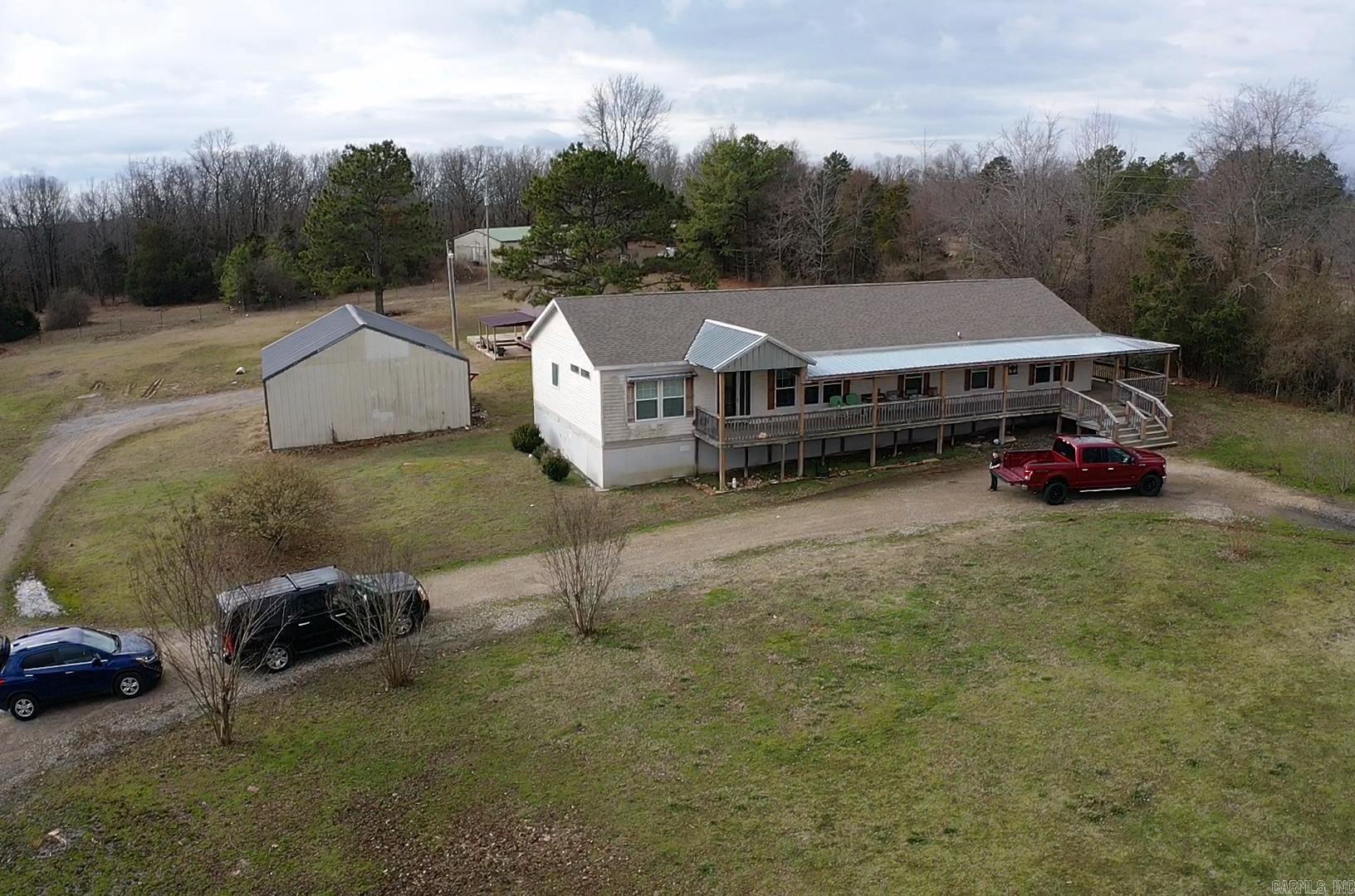 Beautiful modular home that sits on 3.86 acres along with a 30x30 shop and a 10x16 storage building with a lean to. The underpinning was updated to hardy board in 2022. This home is a 3 bed 2 bath with a mud room that could be used as a 4th bedroom. The master bathroom is highlighted with a large walk in tiled shower.