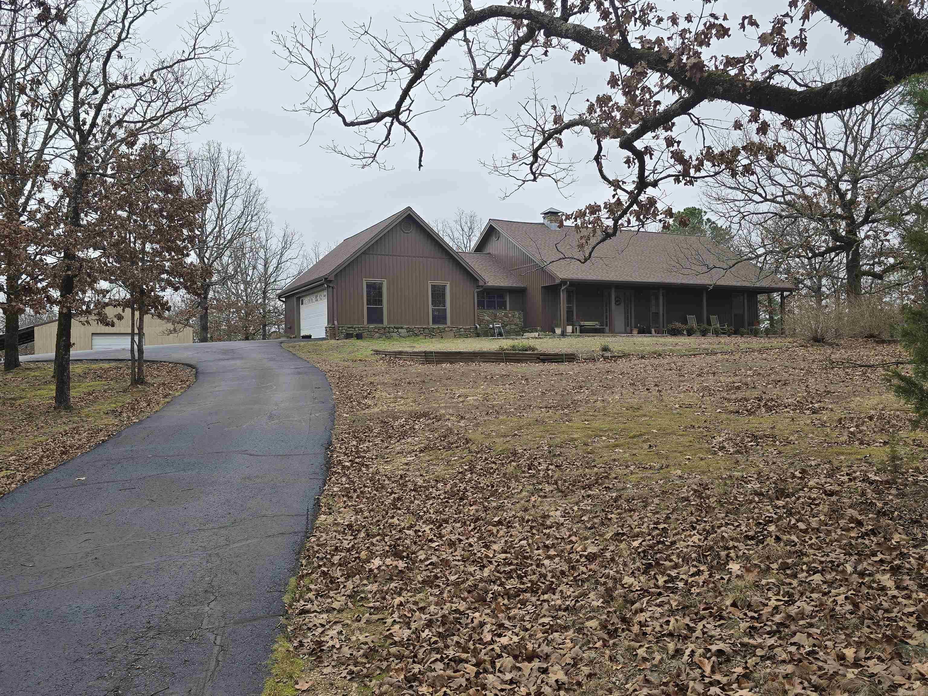 PRIVATE!! Private drive and gate on a freshly resealed drive with a turn around loop, Enjoy the wild life from your front or back porch. This home has a brand new roof, brand new siding & gutters, wood burning fire place with vaulted ceilings Livingroom, walk in closets, Brand new generator for backup power, HUGE shop with bay door and 2 side access doors all on over 7 ac of wooded land for extra privacy.