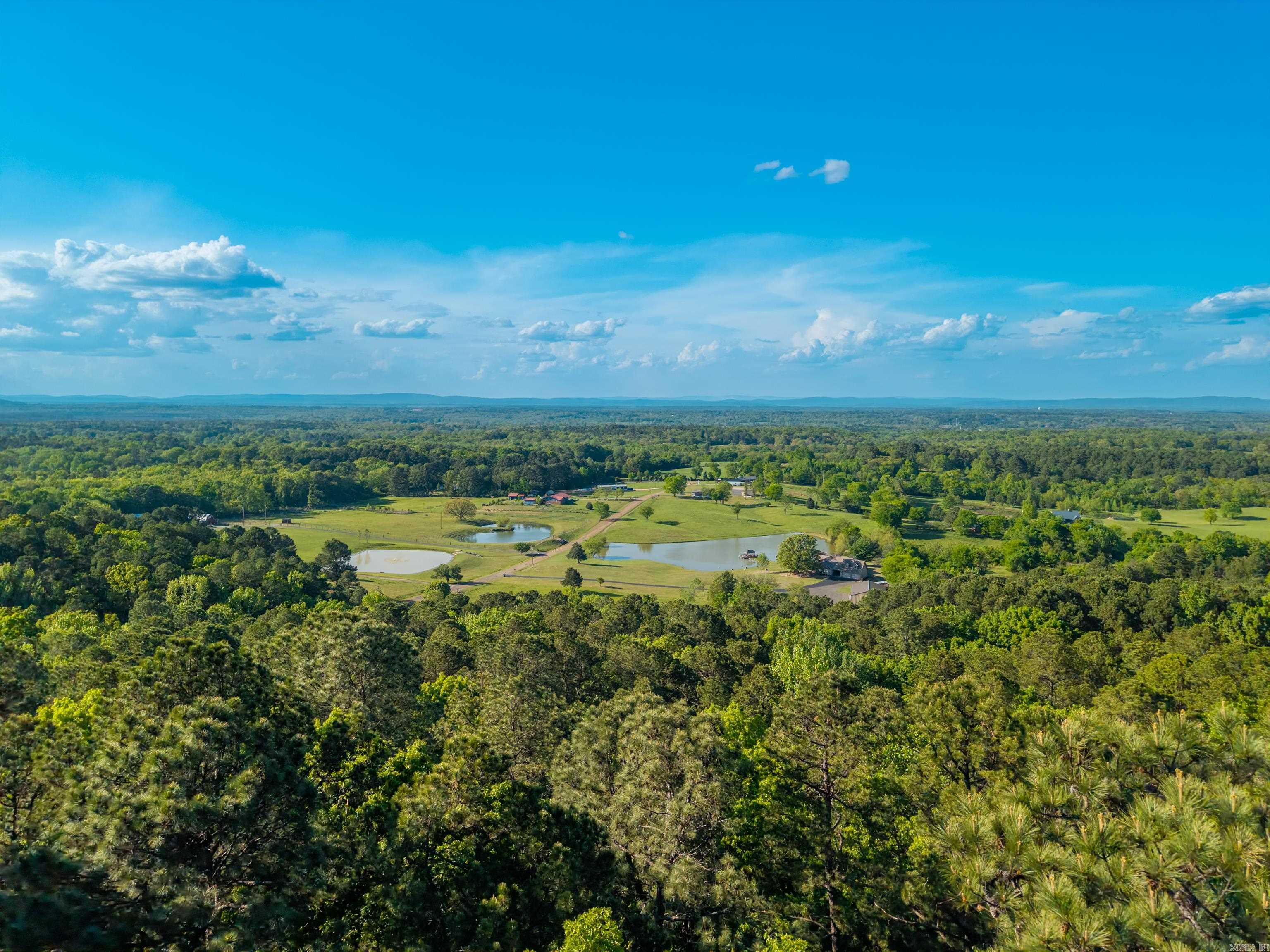 This expansive 10.7-acre estate just off Amity Road, offers a private, high-elevation retreat with significant potential for customization. The property is secured by a gated entrance and features a landscape defined by natural beauty, including mountain views and a private pond. some of the key features are 10.7 acres of beautiful land, 3 bedroom, 2 bath, enhanced privacy via a gated entrance.