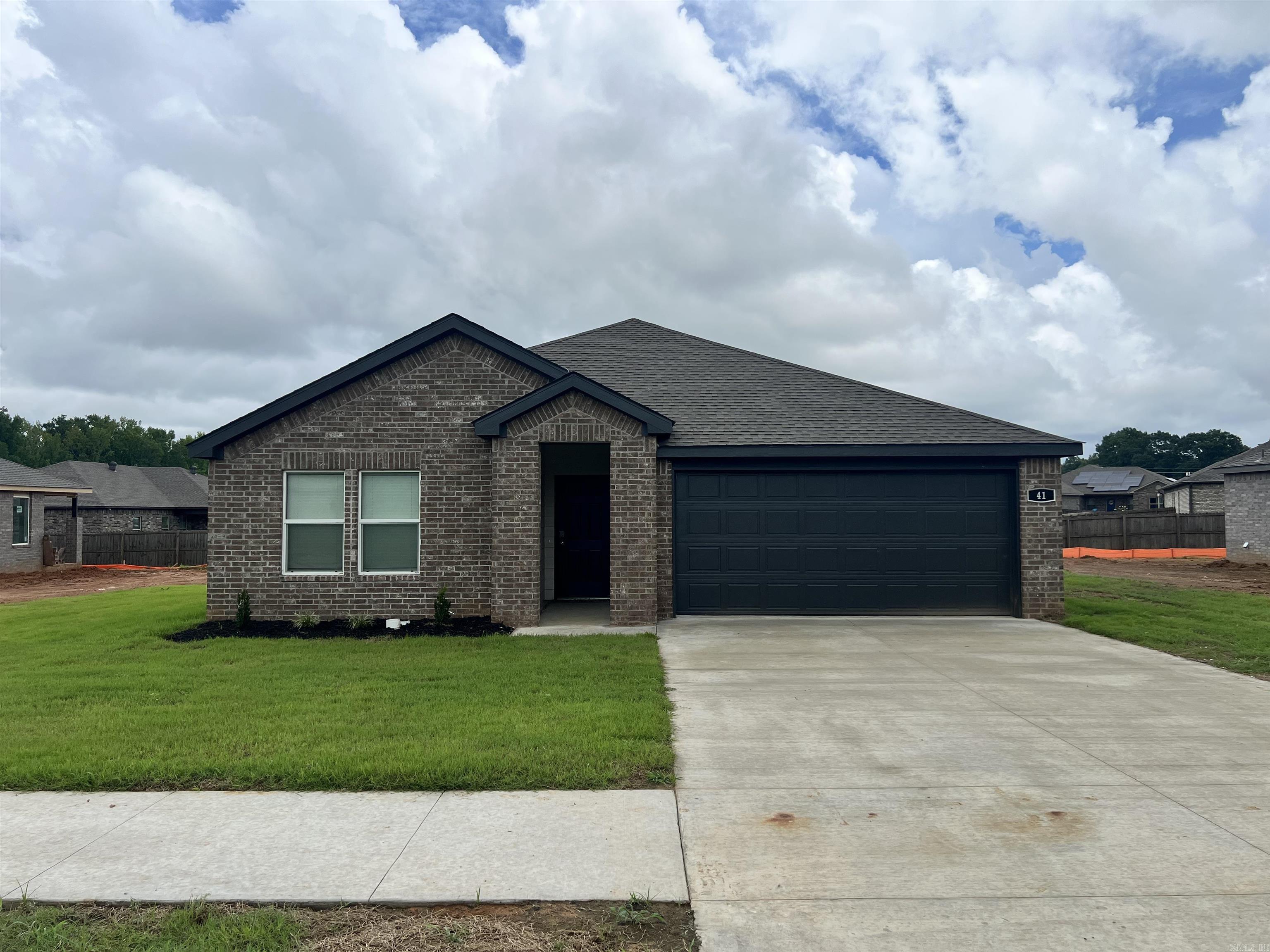 Jubilant Justin plan in Wolfsbridge at Cabot, located in Cabot, Arkansas!These new construction homes feature modern finishes for comfortable living! Each home has LVP flooring and carpet.  In the kitchen and bathrooms, you’ll find beautiful quartz countertops. The primary bathroom features a walk-in shower and a quartz vanity!  Each home will have 4-sides brick with Hardie® siding per plan. These homes come with a programmable thermostat! 10-year limited Homebuyer’s Warranty! Photos may be stock photos, representative of plan only and may vary as built. Annual taxes is an estimate.  HOA is $375 with a $75 Transfer fee.