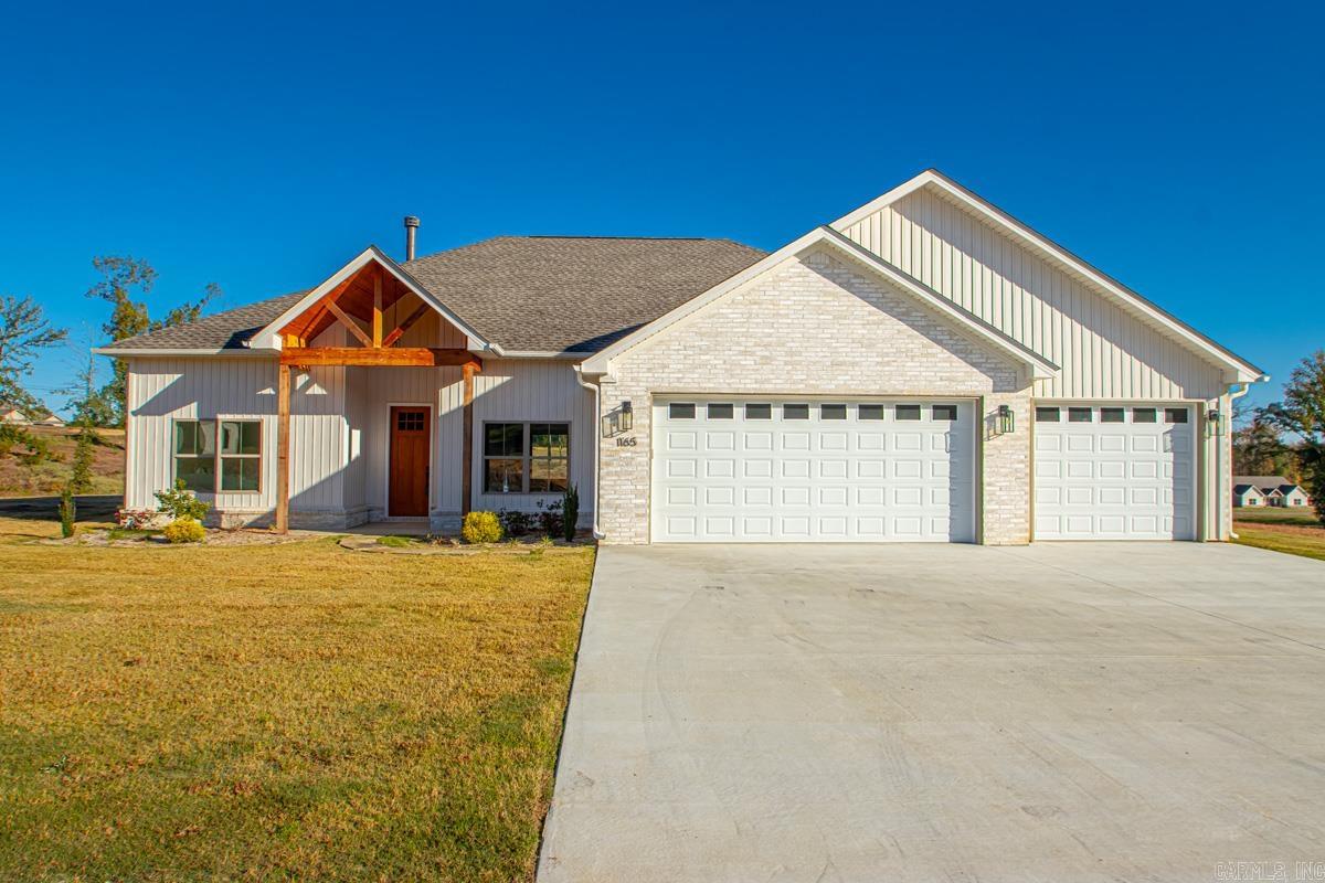 Discover this stunning 4-bedroom, 2-bathroom new construction home nestled on a spacious 1.39 acre lot. Boasting 11-foot ceilings, this home features a dedicated office, flex room that you could use as a game room, den, 2nd office or 4th bedroom. Other features include a cozy wood-burning fireplace and walk-in pantry with butcher block countertops. The kitchen is a chef's dream!! Equipped with two ovens perfect for entertaining, ample cabinetry for all of your storage needs and plenty of counter space. The luxurious primary suite offers a spa-like retreat with a walk-in tile shower and expansive his-and-hers walk-in closets complete with built-ins. Come enjoy the perfect blend of style, comfort, and country living in this exceptional home!
