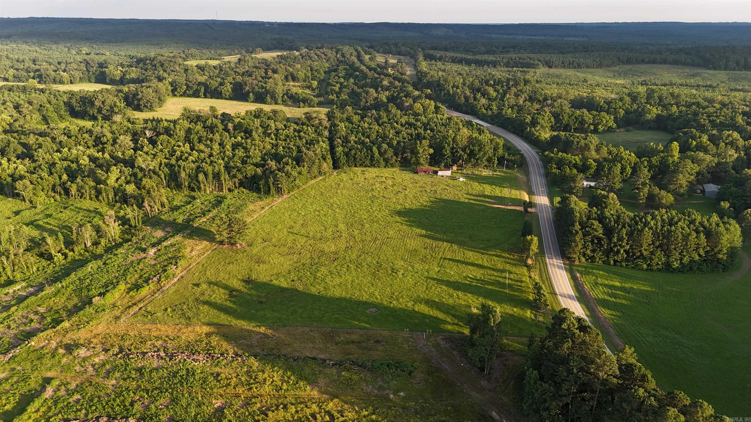 72 beautiful acres ideally located between Dierks and Nashville, Arkansas, with convenient frontage along Highway 278. Situated approximately 6.5 miles from Dierks and 13 miles from Nashville, this property offers the perfect combination of privacy, accessibility, and endless potential.  Messer Creek borders more than 1,800 feet of the property, creating a scenic natural boundary and adding to the property’s unique appeal. With Weyerhaeuser land and Highway 278 bordering the remainder, this tract offers an exceptionally private setting for your future home, farm, or recreational retreat.  The property features approximately 21 acres of mature hardwood timber, 11 acres of established pasture with new fencing, and 40 acres of cleared land where the stumps have already been removed and piled—saving significant time and expense for future development.  Natural gas, rural water, and electricity are available, making this property ready for your vision. Whether you’re searching for a private homesite, acreage for livestock, recreational land, or an investment opportunity, this versatile tract has plenty to offer.  Seller will consider subdividing the property under the right conditions