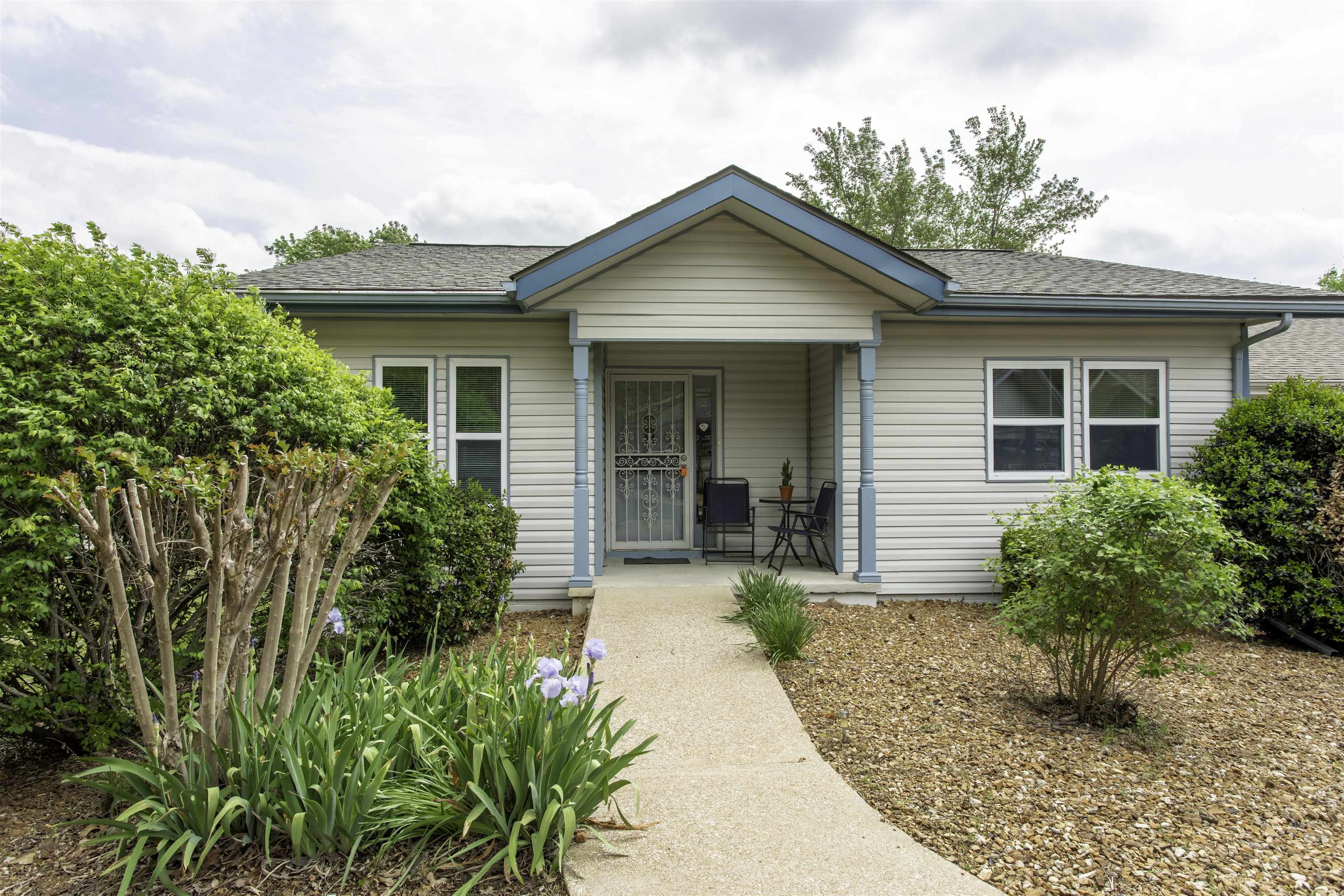 Turnkey one-level end-unit townhouse with strong Airbnb/short-term rental potential in Cherokee Village. Sold fully furnished—including hot tub, appliances, and furniture—this is a ready-to-go investment or low-maintenance full-time home.  Features include 2 bedrooms, 1.5 baths, eat-in kitchen, dining area, and spacious living room. Energy-efficient living with installed, paid-for solar panels—keeping electric bills extremely low. Newer roof around 2022. New exterior paint. Very well maintained by seller. Real estate taxes basically non existent for owner occupancy with the homestead credit of Arkansas.   Enjoy outdoor living on the covered, screened rear deck with a peaceful yard setting. End unit offers added privacy. Includes double carport and no yard maintenance.  Access to community amenities including 2 swimming pools (one indoor year-round), plus Cherokee Village’s 7 lakes, 2 golf courses, recreation centers, parks, and scenic walking trails in the Ozarks of Arkansas.  Shown by appointment—ideal for investors or second-home buyers.