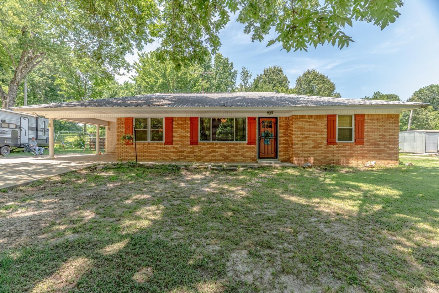 Escape to your own private retreat at 252 CR 700, where peaceful country living meets endless possibilities. Nestled on beautiful Crowley's Ridge, this .89+/- acres property offers the privacy and seclusion you've been searching for while only 4 minutes from Wynne. This 3 bedroom, 1 1/2 bathroom home has a brick exterior and metal roof. It has a designated laundry area with space for storage and it offers tile floors throughout. The covered patio is a beautiful place to unwind and watch wildlife. Storage for outside tools and toys is available in the red shed that stays with the property. If you're looking for a quiet place to call home, this property delivers a serene setting away from the hustle and bustle.