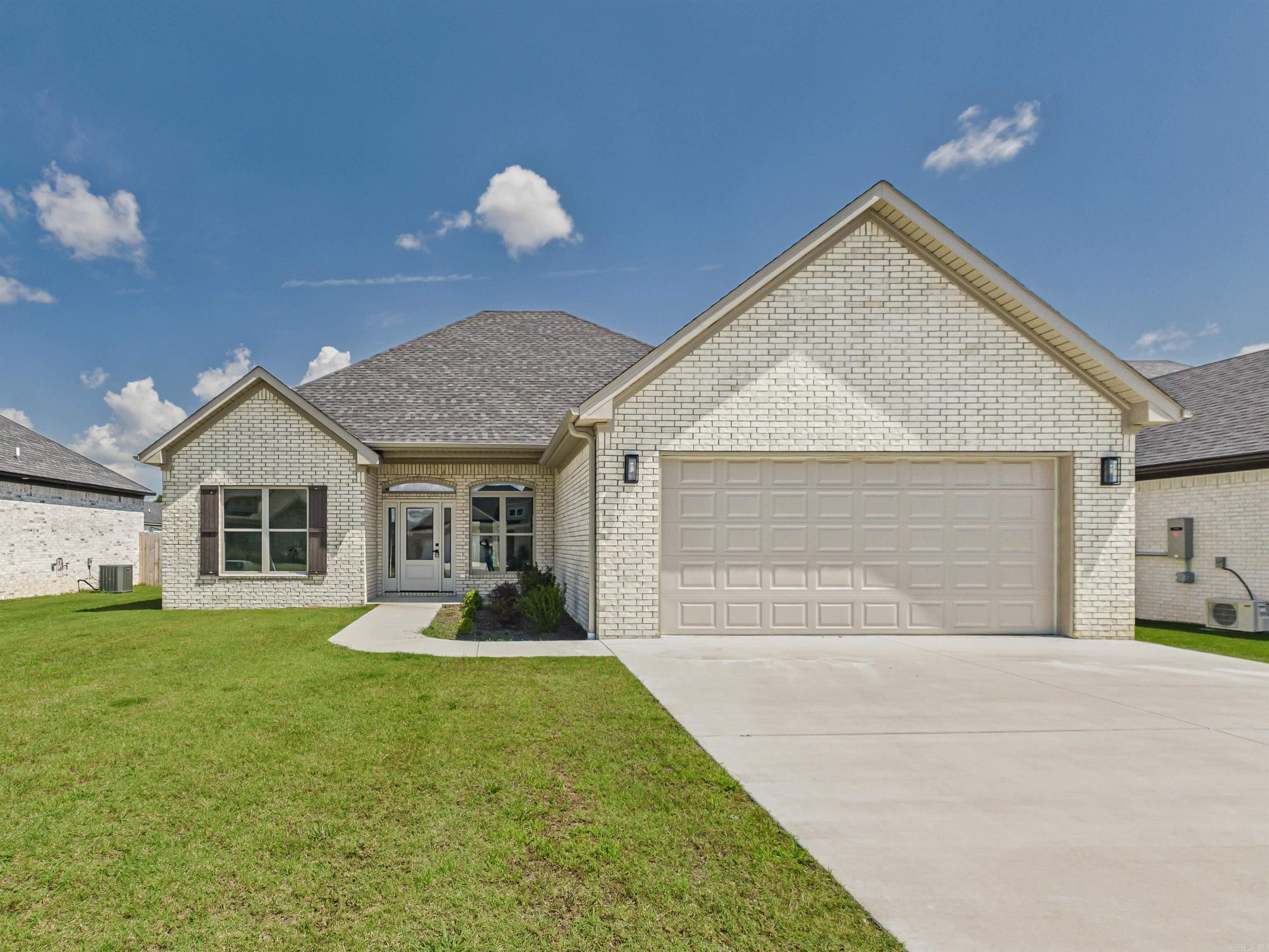 This NEW CONSTRUCTION and ALL BRICK beautifully appointed 3 bed, 2 bath home blends style and comfort with an open layout. Tall ceilings, beautiful trim work lvp , beautiful vaulter ceiling and cool fireplace. The kitchen shines with quartz countertops, pantry, ss appliances and modern appeal, The primary bath includes a gorgeous tile shower, vessel tub and so much more. Enjoy mornings on the back porch and evenings in the large backyard—perfect for making memories. This is a must see. ** See remarks**