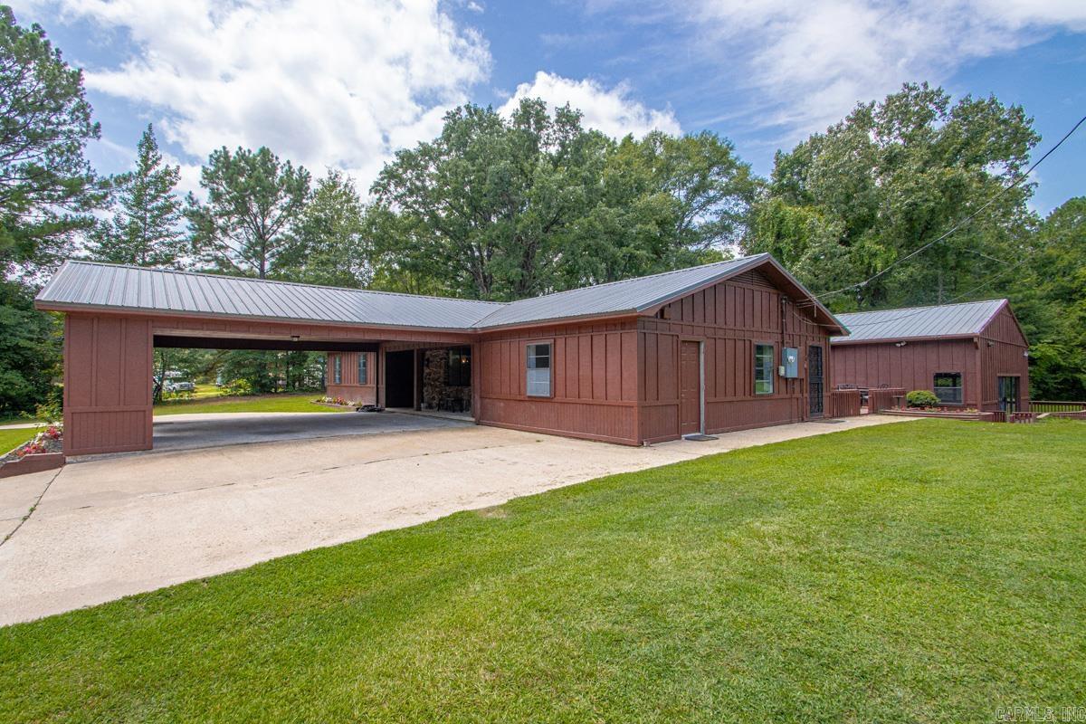 Talk about WOW! Welcome to your own private retreat on over 5 beautiful acres. Every inch of this property reflects incredible care and craftsmanship. This stunning open-concept living space is highlighted by a gorgeous brick archway, warm finishes, and a beautifully remodeled kitchen that’s truly the heart of the home. Fresh paint and stain throughout the interior and exterior, updated lighting, waterproof laminate flooring, new trim, custom cabinetry, stunning butcher block countertops, brand-new appliances, and a new metal roof (2024). These are just the beginning of the extensive renovations. There is also a pole barn with its own storage room. Every space has been thoughtfully updated with quality and functionality in mind, creating a home that’s truly move-in ready. This home offers a sunroom that’s heated and cooled, a mudroom, and thoughtful updates around every corner. And then there’s the showstopper…Step into your private indoor pool house. Complete with its own full bathroom, a brand-new tankless water heater, the ability to heat the pool for year-round enjoyment, along with a wraparound deck. Pool heater is 1 year old.  Some photos have been staged using AI technology.