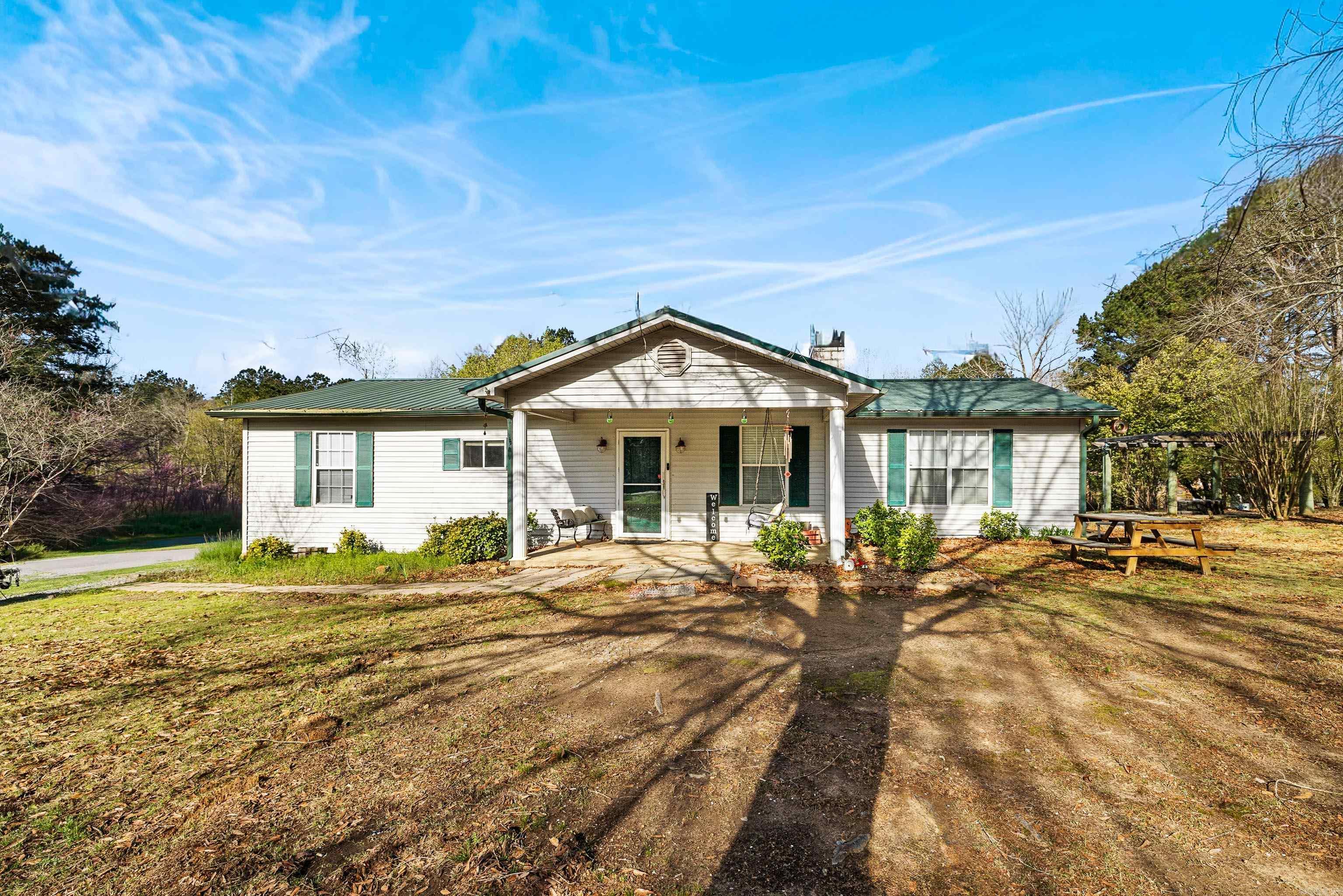 This charming country home offers the perfect blend of privacy and convenience just minutes from Little Rock. Located within the Bryant school district, this property provides a quiet rural setting while still being less than 20 miles away from the amenities, shopping and entertainment.   This inviting 3 bedroom 2-bath home sits on nearly 3 acres, giving you plenty of space to enjoy the outdoors, garden or to simply relax. Step outside and enjoy the space and scenic surroundings, with room for outdoor gatherings, recreation, or future additions. The property offers access to a community pond, perfect for peaceful evenings by the water.  Whether you are looking for room to spread out or a quiet retreat close to town, this property offers the best of both worlds country living with convenient access and top-rated schools.  Schedule  your showing today!