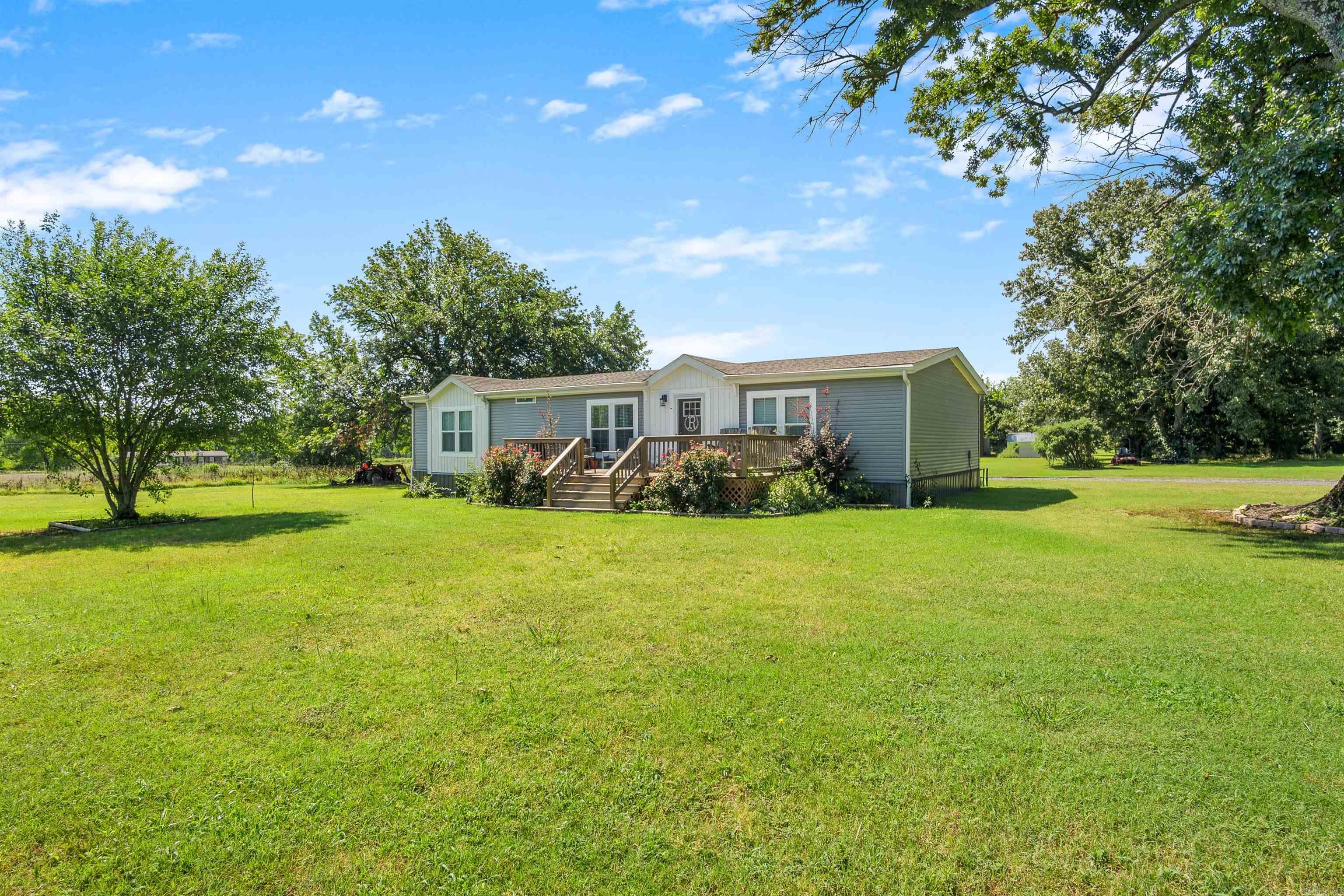 Welcome to Allison Drive! This 3 bedroom, 2 bath manufactured home sits on approximately 4 picturesque acres. Built just 5 years ago, this home boasts an open concept floor plan featuring luxury vinyl plank flooring throughout, a gorgeous kitchen, and a spacious living area that's perfect for family gatherings. Outside, you'll love the beautiful acreage, offering room to relax, garden, or just enjoy the peaceful surroundings. A storage shed with electricity adds functionality for hobbies, a small workshop, or additional storage. If you've been looking for a newer home with modern finishes, a beautiful setting, and space to enjoy the outdoors, this one is a must see!  *Agents, see remarks*