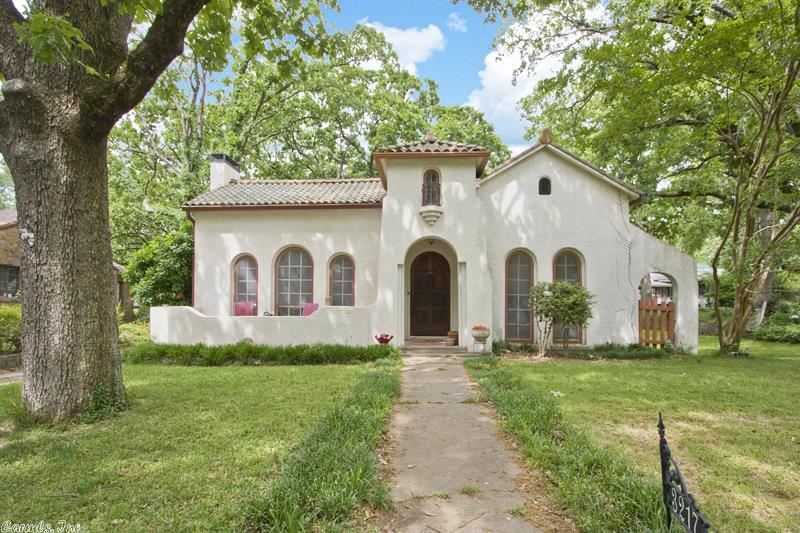 1924 Spanish Revival located in the beautiful Park Hill Historic District.  This house offers a lot of character with the original front door, terracotta tile roof, arched doorways in the main living areas and five rounded arch doors that step onto the patio from the main living room and guest bedroom.  Large lot and huge back deck with detached one car garage and potential office, studio or guest suite.