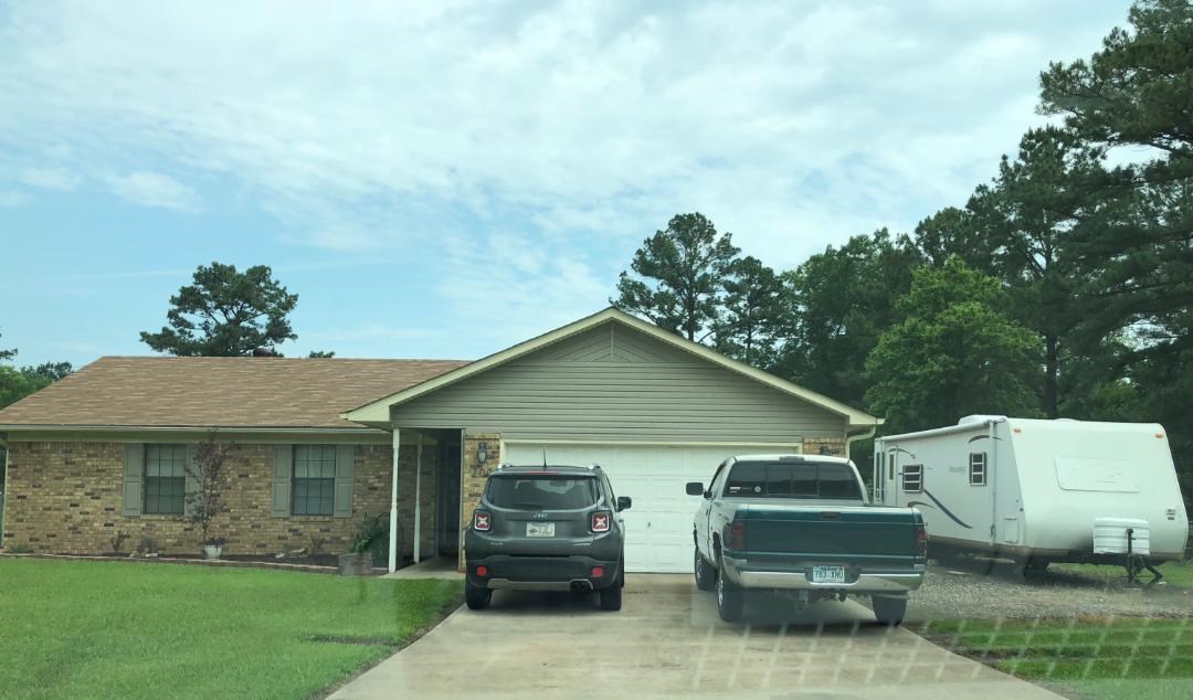 2 Acre corner lot in nice neighborhood; darling house with loads of updates. New roof, new floors, new light & ceiling fans; new cabinets in kitchen, new disposal. Appliances convey.