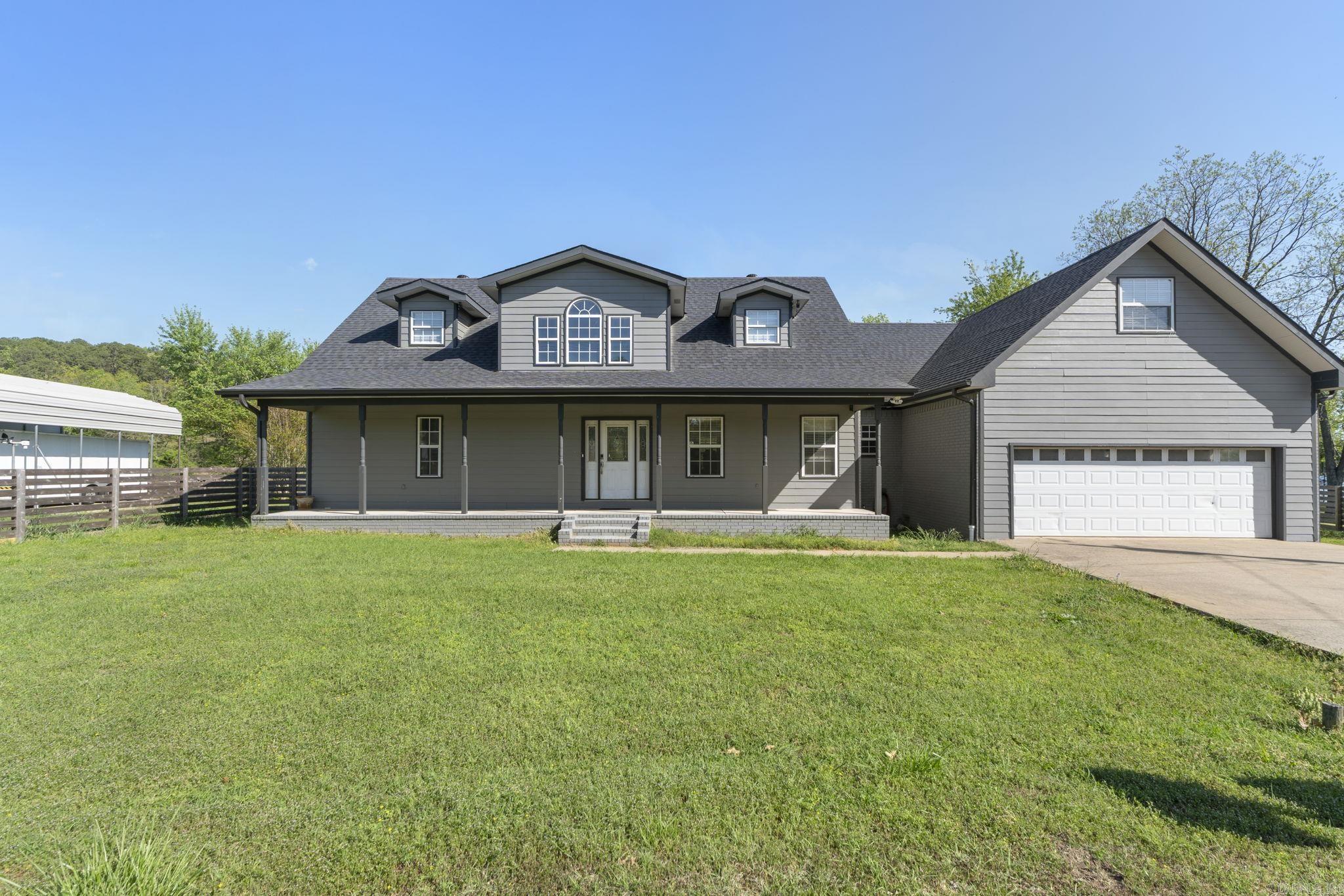 Discover this beautifully remodeled lakefront home on Harris Brake Lake with 210 feet of shoreline on a quiet cove. Filled with natural light and stunning lake views through numerous windows, the home offers comfortable living spaces perfect for daily life or guests. A private above-garage 1-bedroom, 1-bath apartment with kitchenette provides extra versatility. Situated on two fully fenced lots, the property has ample room for covered RV and boat parking. The expansive 20x30 partially covered deck overlooking the water is ideal for enjoying lake vistas or summers grilling out! The primary suite features an ensuite bath with modern soaking tub, walk-in shower, and custom walk-in closet with built-ins. The gourmet kitchen offers SS appliances, plenty of custom cabinetry, ample counter space, and a walk-in pantry. A bright office/sunroom overlooks the lake, while the all-electric home includes propane for the fireplace. Boat docks are permitted. Additional acreage with a 30x40 heated and cooled shop (220V) is available separately across the street. Floor plans included in pics or Click Virtual Tour for interactive Floorplan! Located only 35 minutes to Conway or Little Rock!