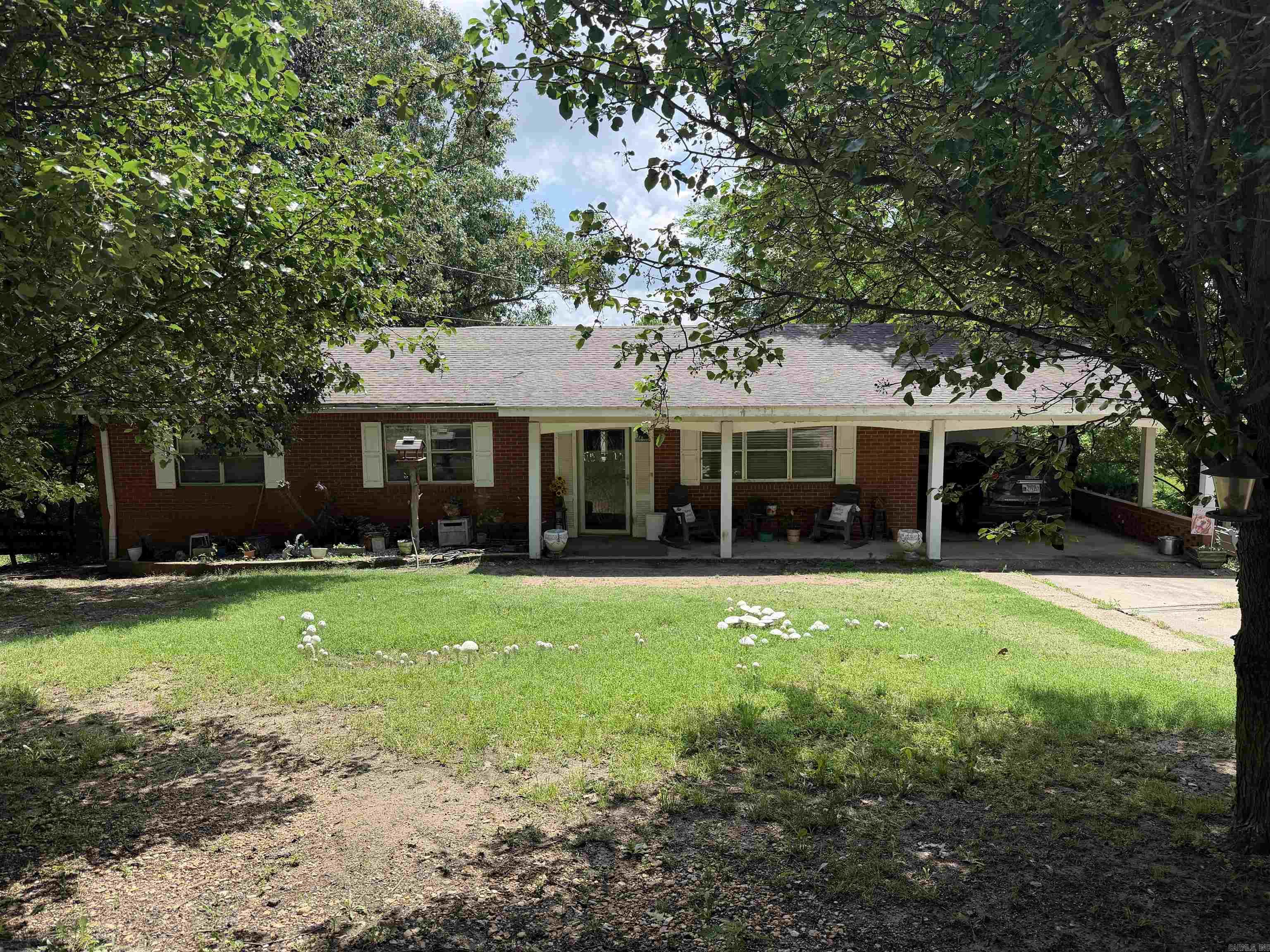 Welcome to this beautiful ranch-style home at 1700 S 12th Ave in Piggott! Situated on 2.14 scenic acres at the edge of town, this spacious 4-bedroom, 3-bath property offers the perfect blend of peaceful country living with the convenience of town nearby. Inside, you’ll find a finished walk-out basement providing extra living and entertaining space for family and guests. Step outside and enjoy the wide-open views, pond and plenty of room to roam. Horse lovers will appreciate the 18x24 horse barn, while hobbyists and outdoor enthusiasts will love the 15x38 shop complete with 30-amp RV parking. Whether you're looking for room to grow, space for animals, or simply a private retreat in an amazing location, this property checks all the boxes!