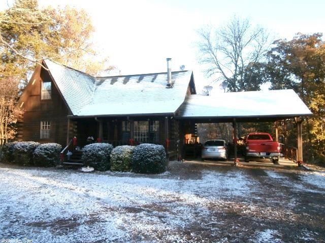 This 2 bed/1.5 bath could easily be transformed into 3-4 bed with 2 full baths. Don't miss this opportunity to own a lovely custom built log home on 5.34 acres in Lake Hamilton School District! Enjoy the mountain views, and the natural spring creek that runs the backside of property. Beautiful stained glass features, and a Diamond Willow staircase handrail add warmth to this amazing property.