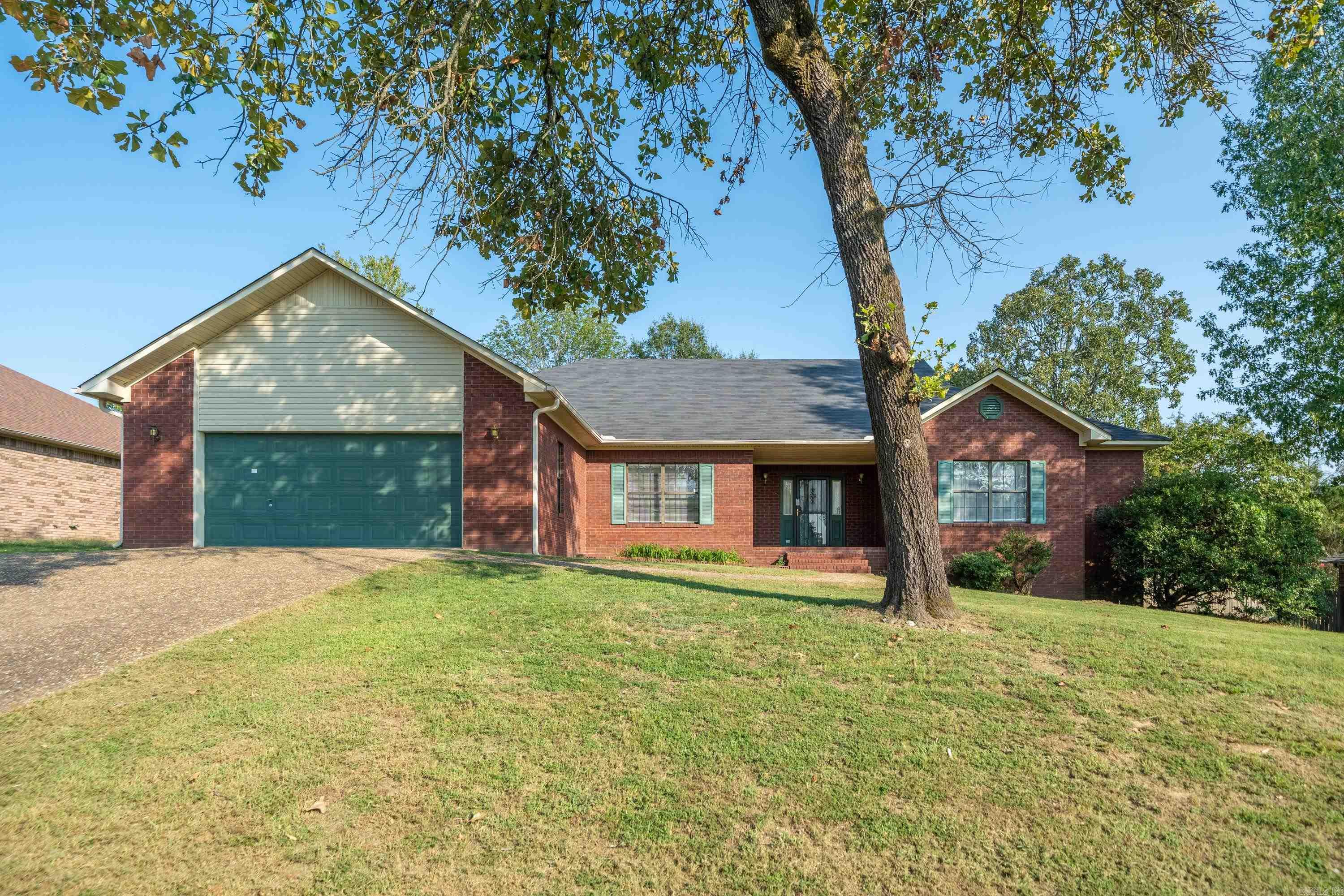 Great New Listing! Split floor plan with spacious Master bedroom with Tray Ceiling and very large Master Bath. Three Bedrooms and 2 & 1/2 Bathrooms. Roomy 2465 Sq. Ft. house is well built and has good bones. High Ceiling in Living Area with beautiful Fireplace. Enjoy the Nice Back Yard from the Wooden Deck. Bonus Laundry Room with large Garage. New Roof! Great Neighborhood close to Lake. Actually only went on the market on September 10th.