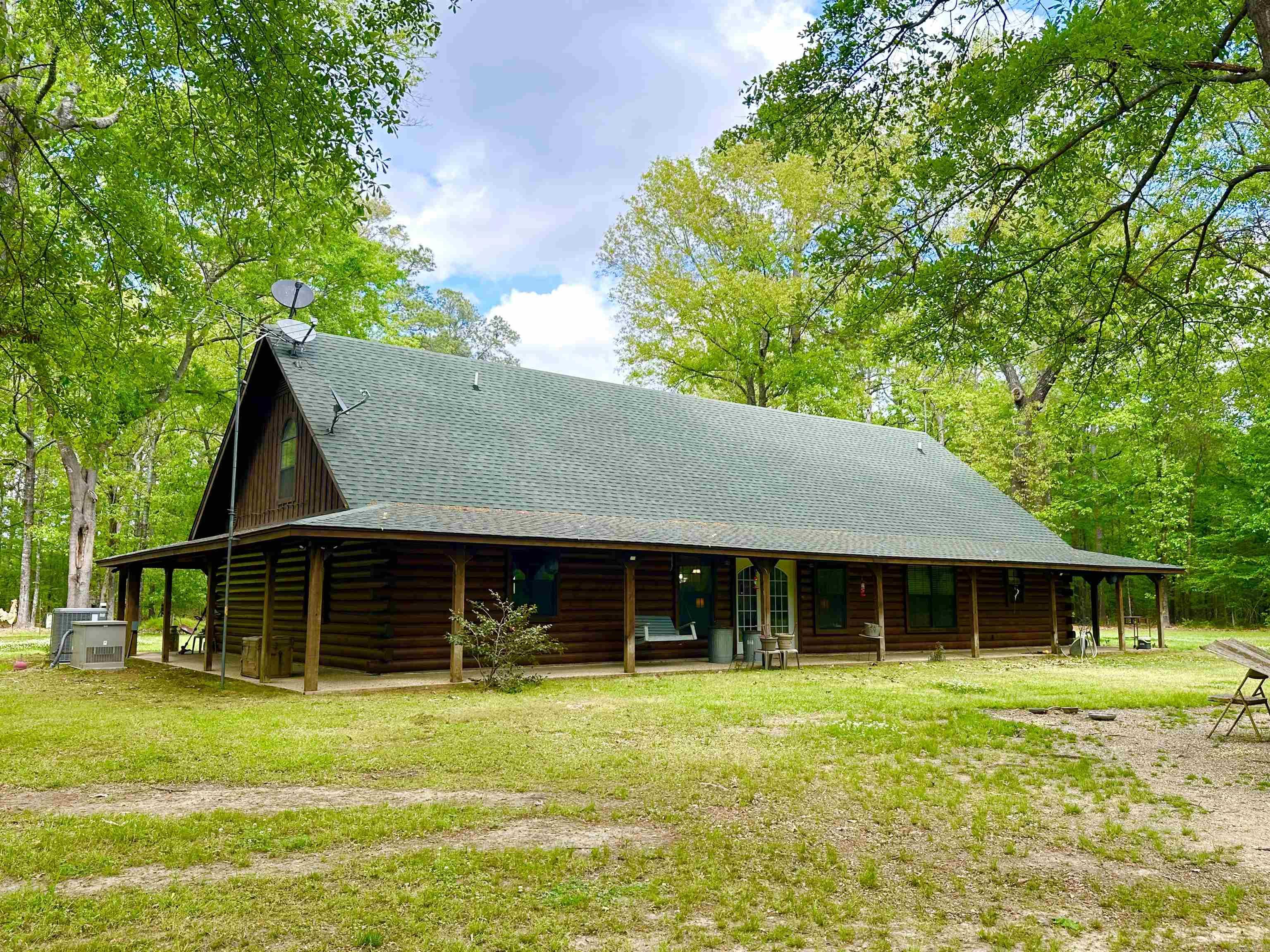 HOME SWEET COUNTRY HOME! Welcome To This Unique, One Of A Kind, Well Thought Out True Log Cabin! Made With Aspen & Pole Pine Only Found In The NW Part Of The Country! This Home Offers A Full Wrap Around Porch, Mud Room, Open Floor Concept, Split Floor Plan, And A Loft! Every Detail Was Thought Of When Building This Beautiful Home! Exterior Logs On Home Were Just Resealed This Year! Large Shop With (2) 20X30 Insulated Buildings & A 50X30 Open Space In Between All Under One Roof! Lots Of Privacy, Well Insulated, Back Up Generator, HUGE Master Suite And So Much More! This Home Is A Must See!