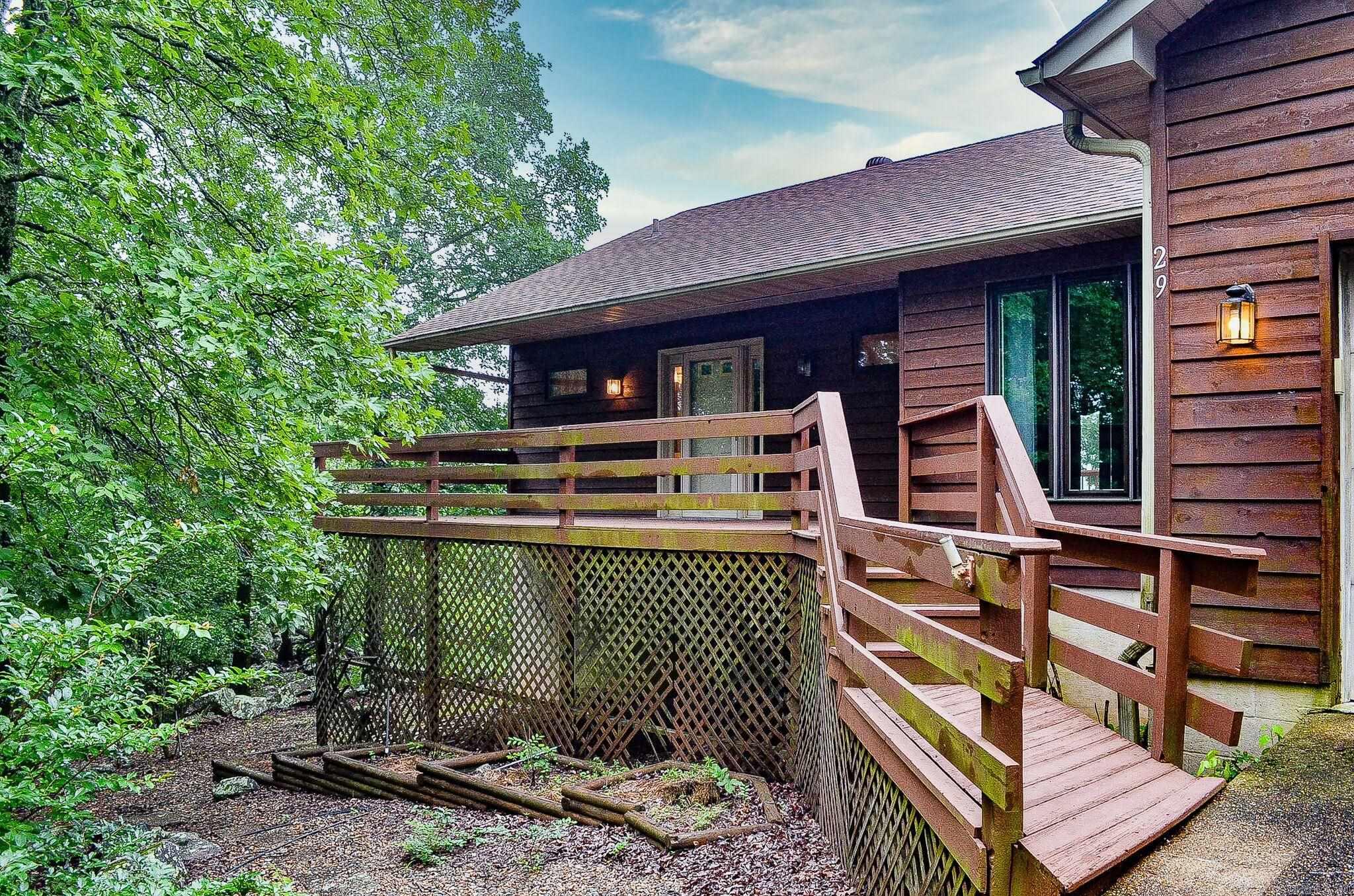 Breath-taking views and oodles of space welcome you to this custom constructed home located close to the Hot Springs Village Look-out spot.  3 bedroom 2.5 bath home is loaded with storage. Entry level hosts primary suite, laundry/pantry, dining area, living area with fireplace, half bath and 2 wonderful walk-in storage rooms. Lower level is ideal for game room with wet bar and 2 bedrooms with another full bath. There is a workshop area that enters either from the inside or outside of the home. Hot Springs Village Property Owner Association has a new member buy-in fee of $2,000.00 due and collected at closing.