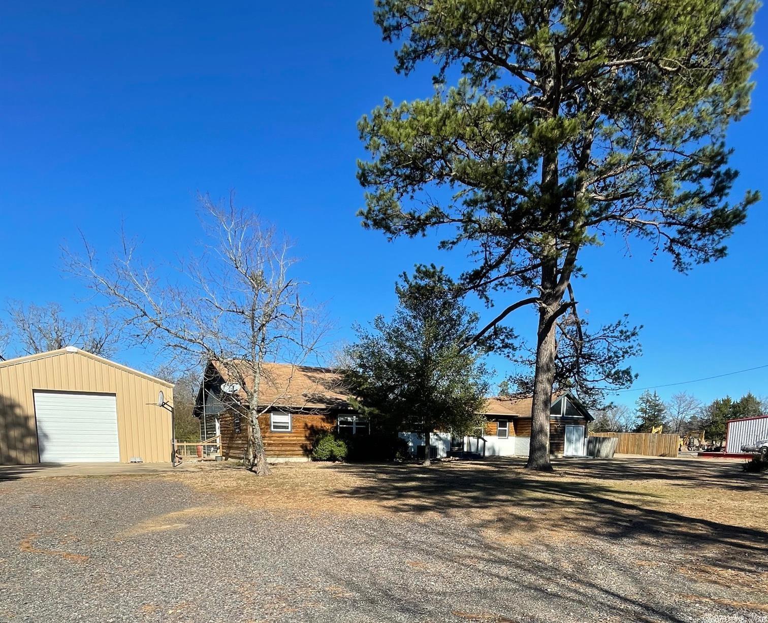 Rare opportunity! Own this large home at an unbelievable price, including outbuildings and an in-ground swimming pool. Large home, 2 Masters, so many possibilities - you don't want to miss out! Nice level land, lots of rooms. Large shop. Located just outside the Mena city limits.  Buyer financing fell through.