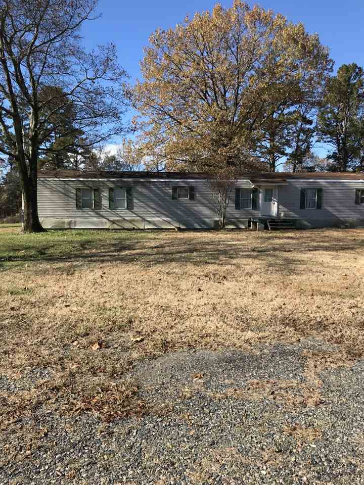 Country Mobile Home - Open, bright, laminate floors, french doors open to deck. Beautiful backyard view. 3.74 acres approximately. Garden tub in master bath, step-in shower, needs some TLC.