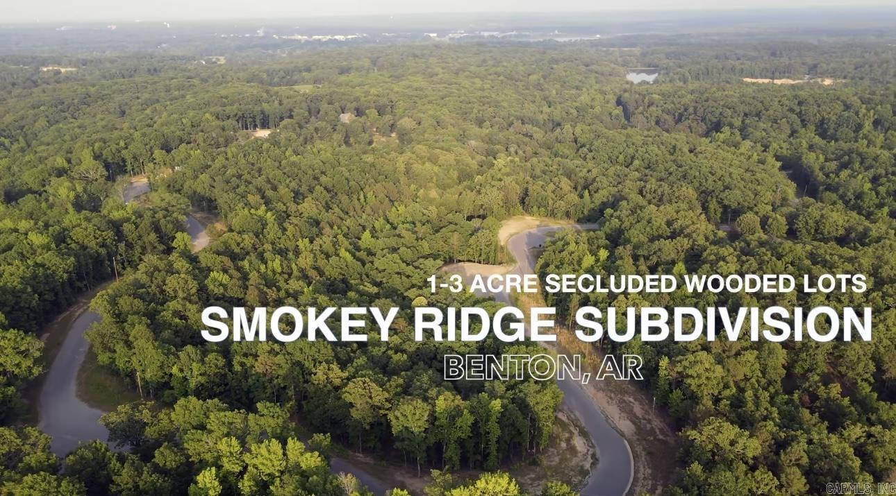 Smokey Ridge Subdivision has secluded lots nestled among mature hardwood trees with blooming Dogwoods. One of the highest points in Saline Co with rolling hills gives way to scenic views. Subdivision is adjacent to the AR Natural Heritage Preserve area with hiking trails to the river. 1-3 acre lots. Private subdivision entrance. City water with fiber internet. Benton's newest growing area with brand new elementary and middle schools nearby. Pick your lot and start building your dream home today. Exit 114 to W. Jackman Trail to Johnson to Smokey Ridge Rd. Smokey Ridge