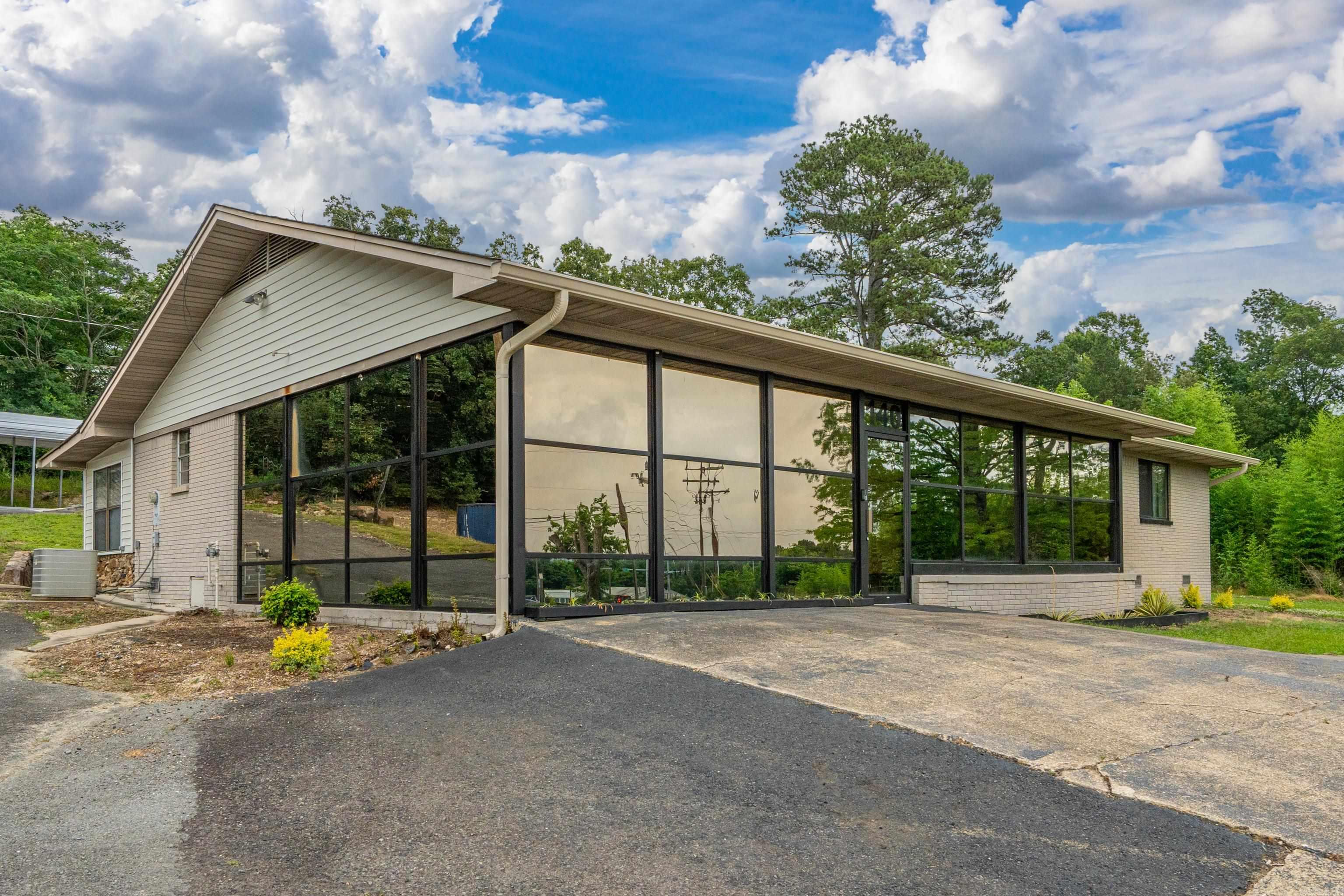 140 Amity Road presents a rare opportunity for a versatile commercial property in Hot Springs, Arkansas, just off Highway 7 South/Central Avenue in a high-traffic, high-visibility location with approximately 500 feet of road frontage. This turnkey property offers incredible flexibility for a retail space, real estate offie, insurance office, mechanic shop, or live/work opportunity. The fully furnished property is in immaculate condition with no detail overlooked and is ready for immediate operation.  Features include ample parking, a 24/24 heated, cooled and insulated shop, separate HAC systems for the home and shop, a newly added 12/20 storage building, carport, new patio, and a roof approximately 2 years old. Located outside city limits, this unique property provides flexibility with residential or business potential.  Priced to sell and move your business into operation immediately.