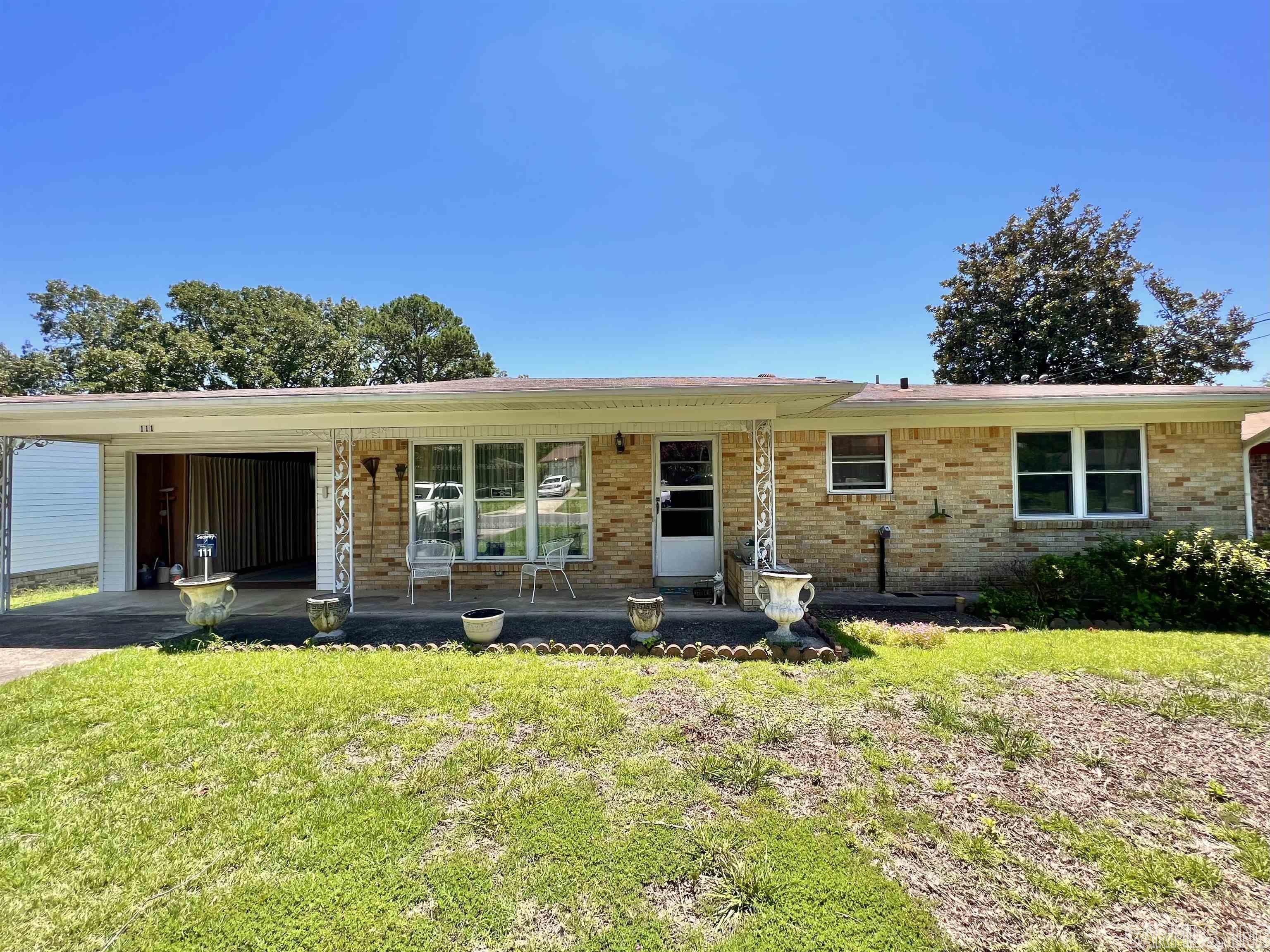 One level charmer with in-ground storm shelter in the garage! Level fenced yard with garden area, workshop storage building, and clothes line! Living room entry makes you feel right at home with loads of natural light from the over-sized windows! Easy to enjoy floor plan with breakfast area in the kitchen and adjoining den, dining room, or office! Additional AR room (not included in sq ft), 2 bedrooms and 1 1/2 baths and separate laundry room. Call today for your private tour of this very well maintained home! Selling As-Is. See agent remarks.