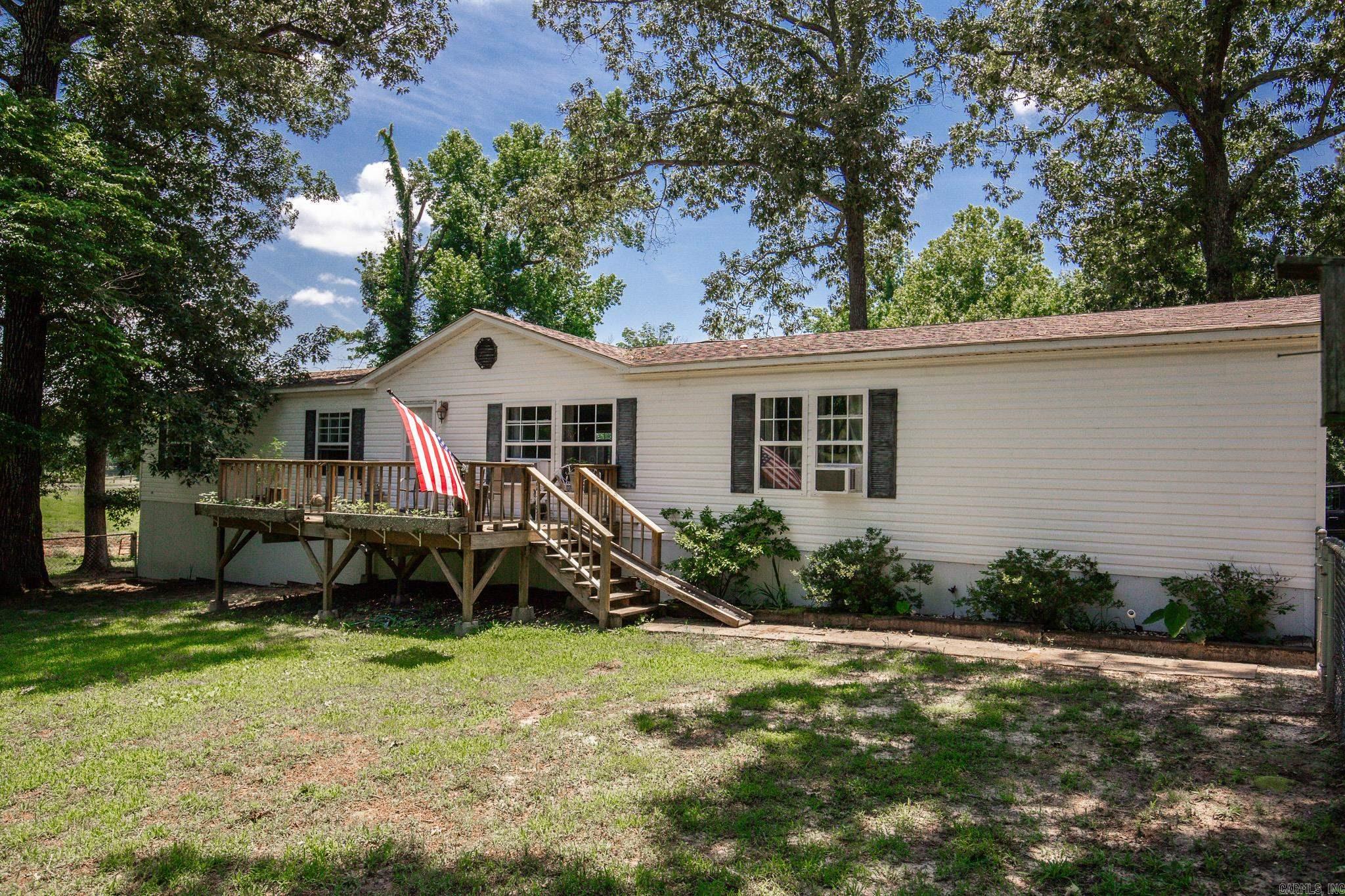 Situated on approximately 2.5 acres in the desirable Sheridan School District, this spacious 2420 sq ft homes offers 4 bedrooms, 2 full bathrooms, and a floor plan designed for a large family.  Inside you'll find two generous living areas, a dedicated dining space, and a beautifully updated kitchen featuring new countertops, a butcher block island, abundant cabinetry, and a large walk in pantry. The cozy fireplace in the den is the perfect gathering spot.  The oversized primary suite is a true retreat, complete with jacuzzi tub, walk in shower, expansive walk in closet and a private office space, nursery or craft room. The home was remodeled in 2012 including a new roof. Need plenty of space? This one has it all!