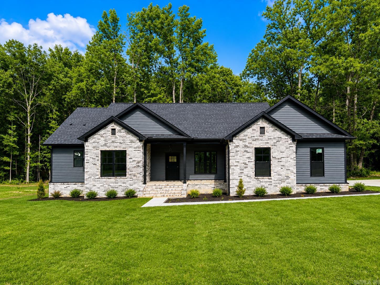 Beautiful new construction modern farmhouse situated on approximately 1 acre in one of the area’s most desirable neighborhoods. This stunning 4-bedroom, 3-bath home offers approximately 2,200 square feet of thoughtfully designed living space featuring an open-concept floor plan, upscale finishes, abundant natural light, and timeless curb appeal. Enjoy spacious living and peaceful surroundings while still being conveniently located near shopping, dining, and everyday amenities.  AGENTS SEE REMARKS