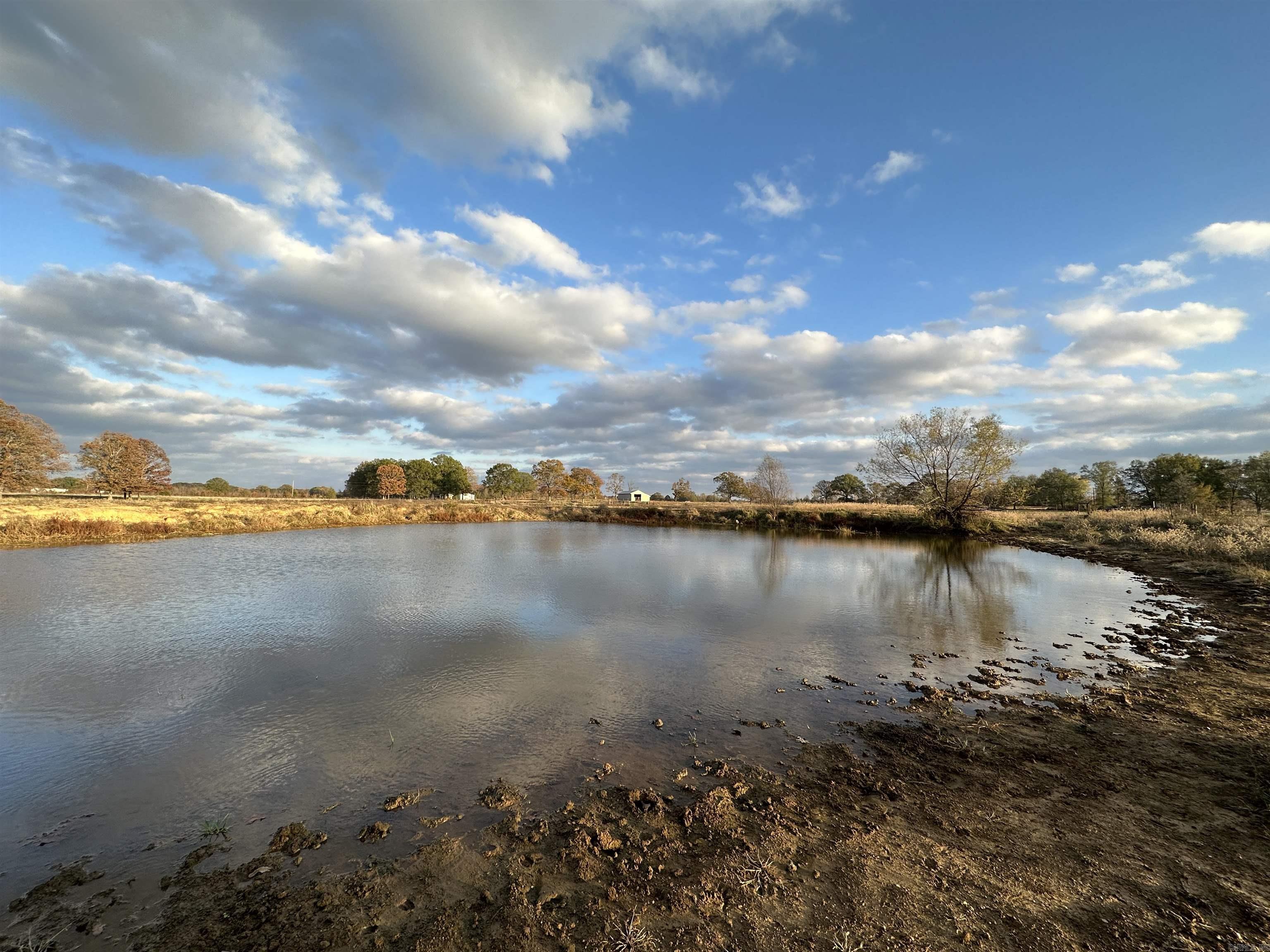 This 35+- acre property is perfect for someone looking to live in the country but having the amenities of and proximity to town. This property is in an outstanding location and would be well suited for a small farm with livestock, or for someone looking for a little more acreage. This property has a small pond and fencing on 3 sides. County water and electric are convenient to the property also. This property is less than 10 minutes from Beebe and less than 15 minutes from Cabot. Also, it's 10 minutes from Hwy. 67/167, and 3 minutes from Hwy. 5. (Additional acreage is available. Agent owned.)   -9 miles to Beebe. -15 miles to Cabot. -20 miles to Conway. -25 miles to North Little Rock. -25 miles to Searcy.